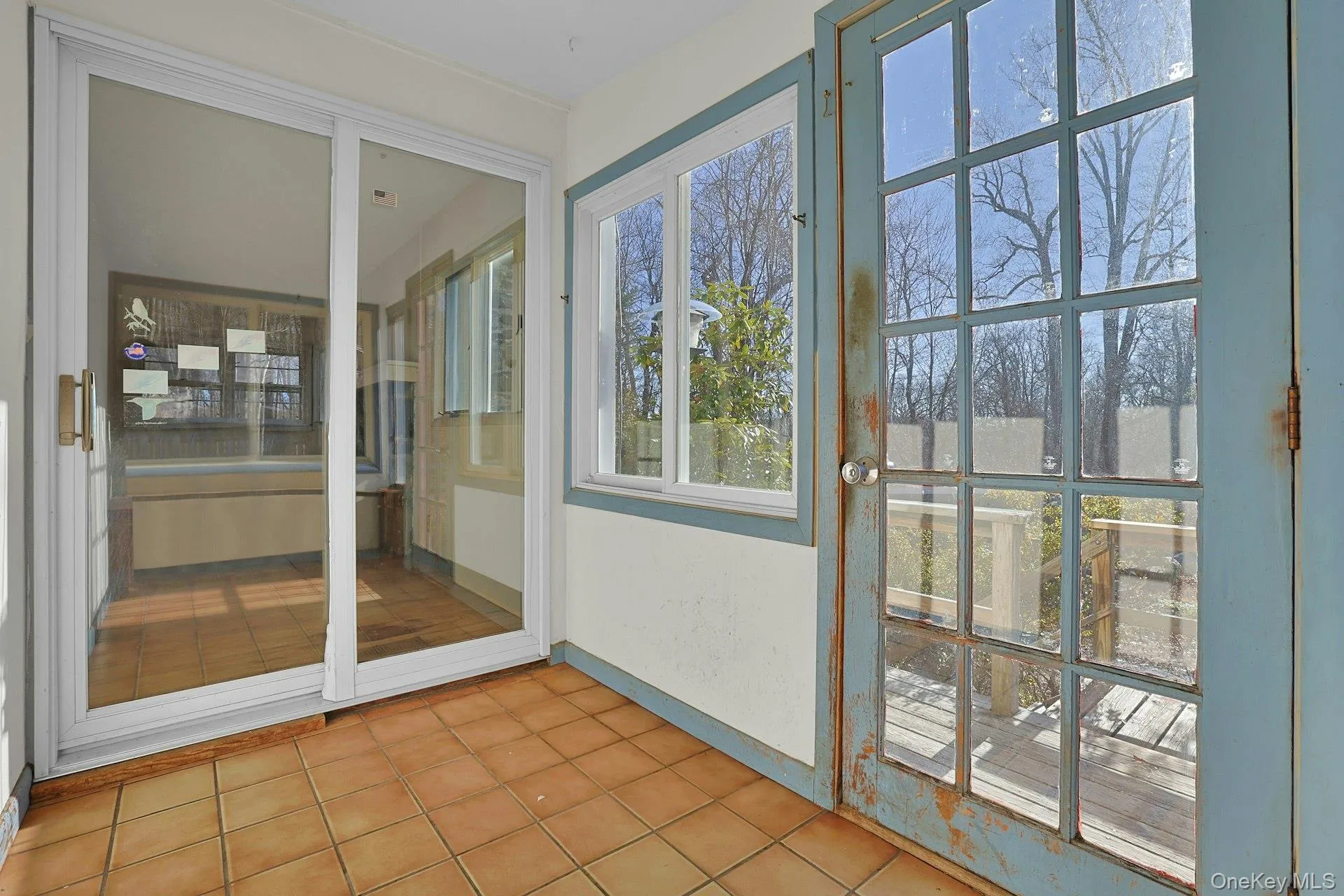 From the entryway, sliding doors open to the living room. From the entryway, sliding doors open to the living room.