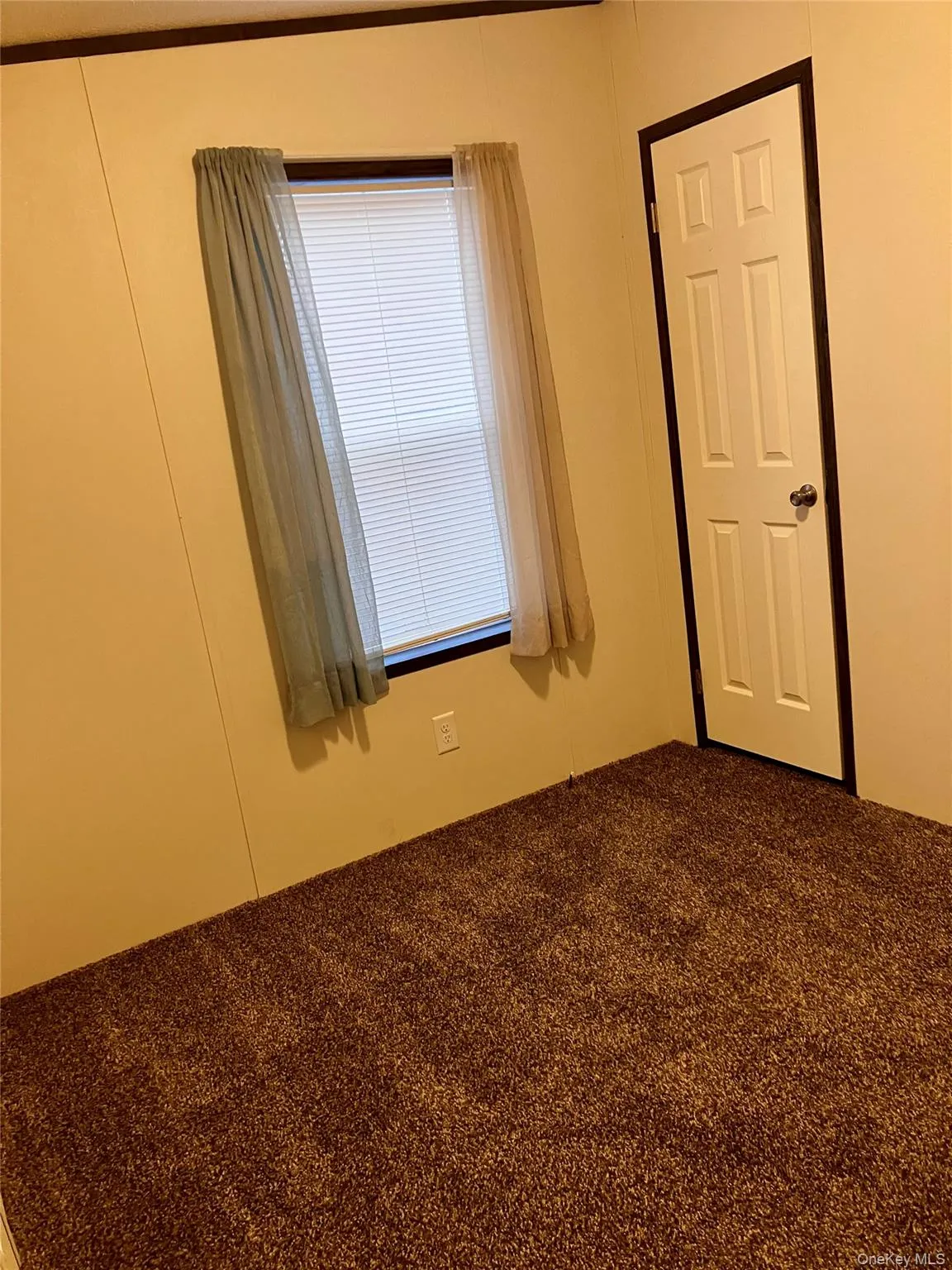 View of carpeted empty room View of carpeted empty room