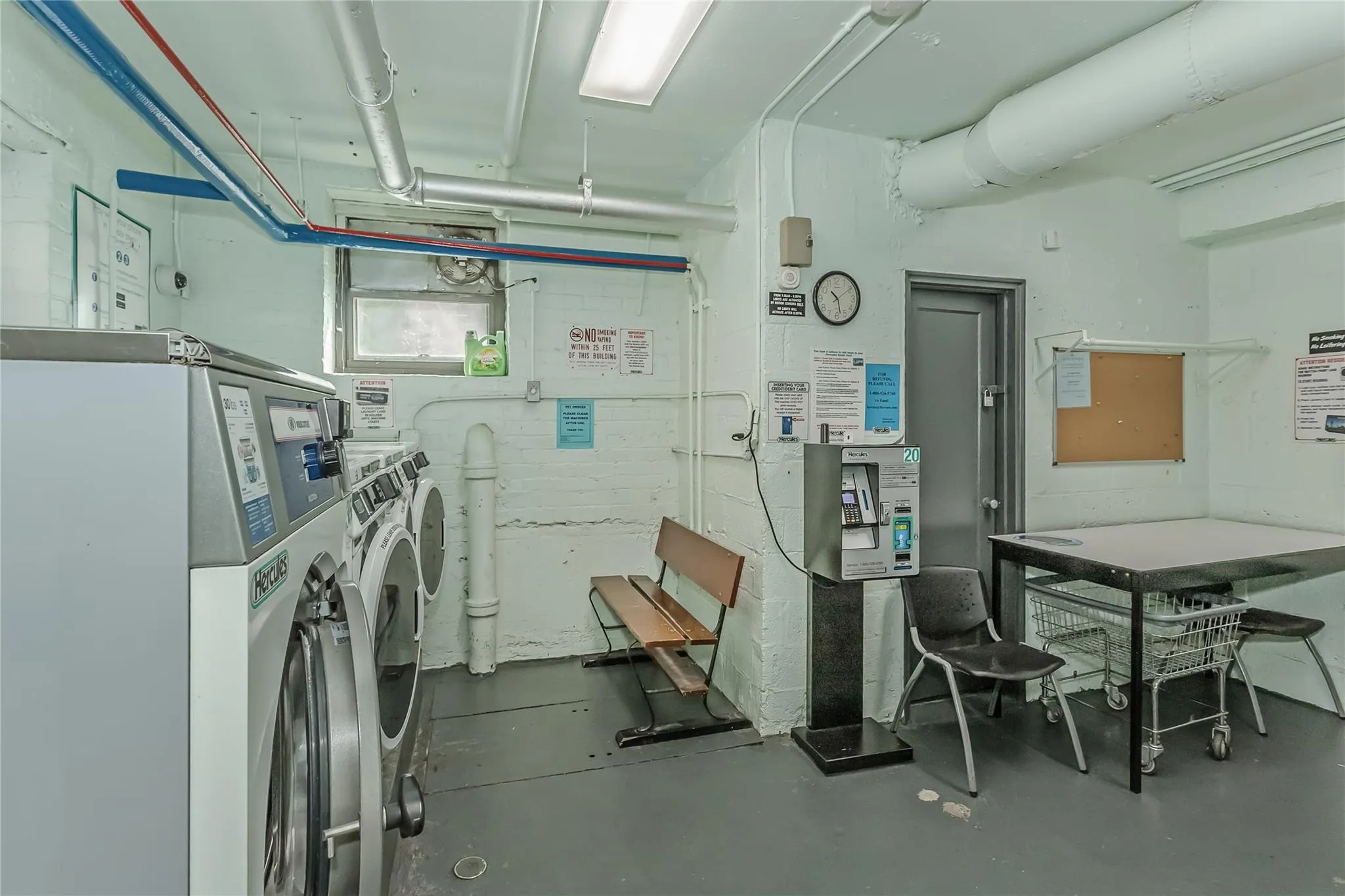 Common laundry area with washing machine and clothes dryer Common laundry area with washing machine and clothes dryer
