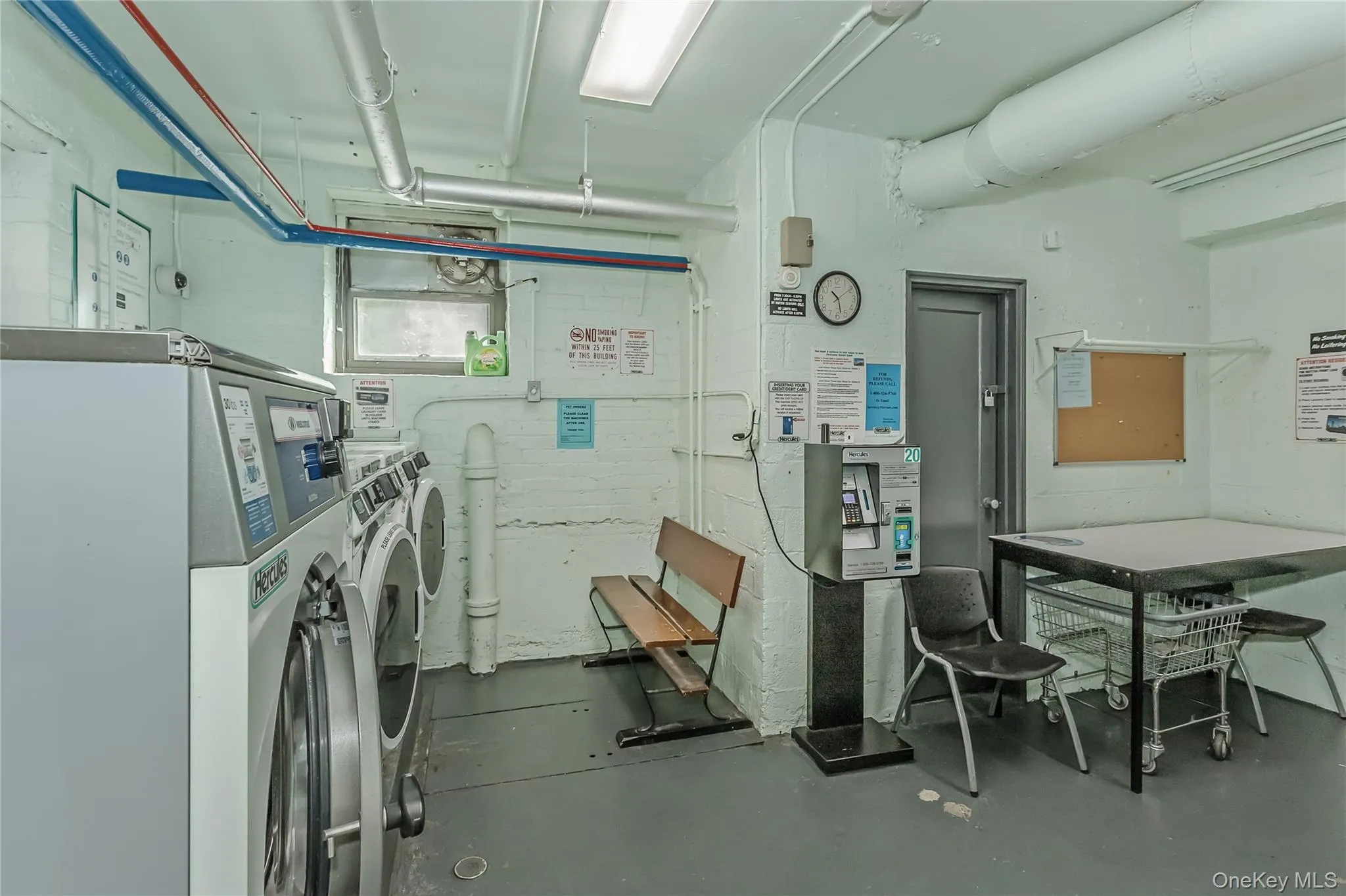 Common laundry area with washing machine and clothes dryer Common laundry area with washing machine and clothes dryer