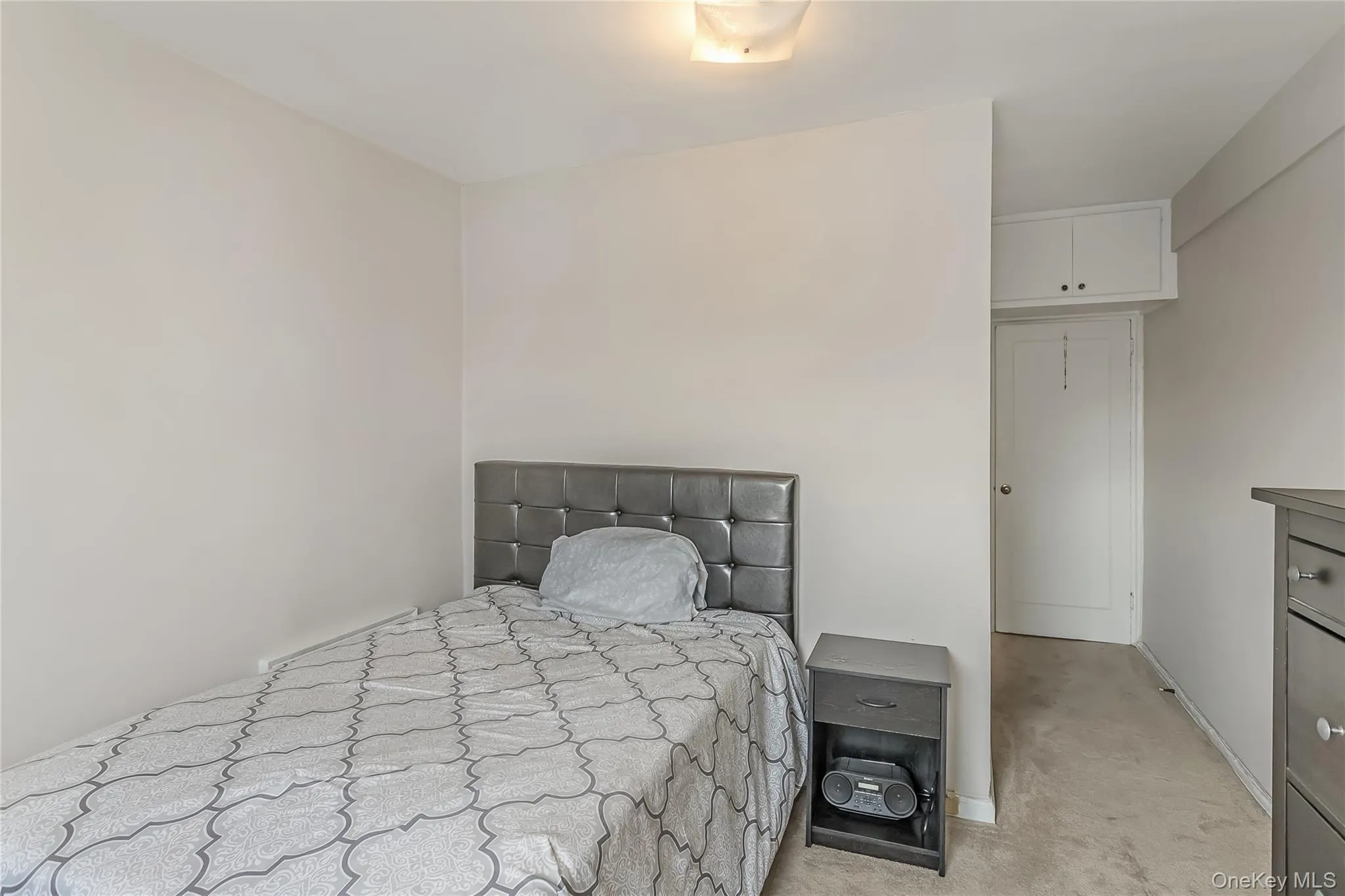 Bedroom featuring light carpet Bedroom featuring light carpet