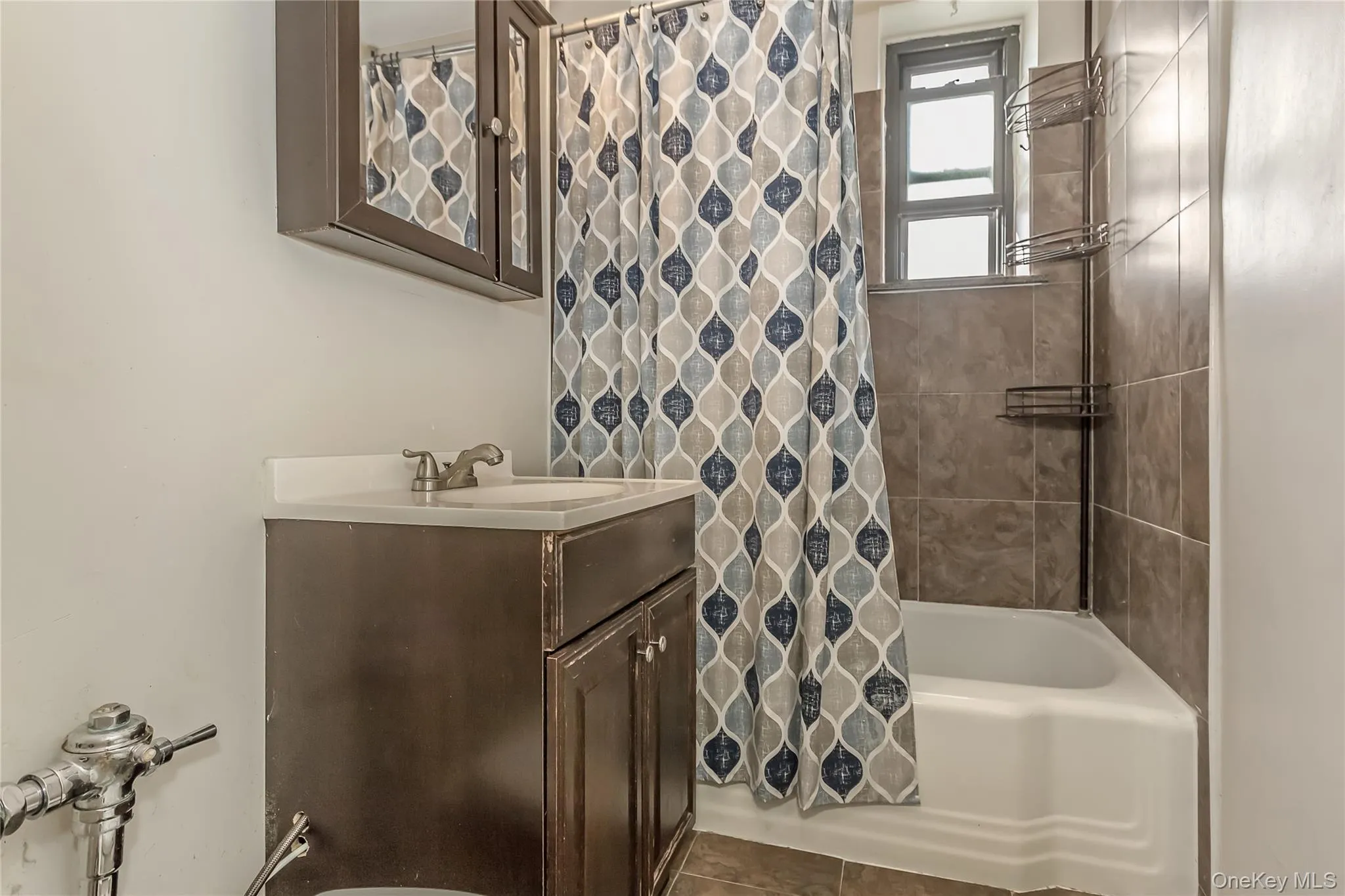 Full bathroom with vanity and shower / bath combination with curtain Full bathroom with vanity and shower / bath combination with curtain