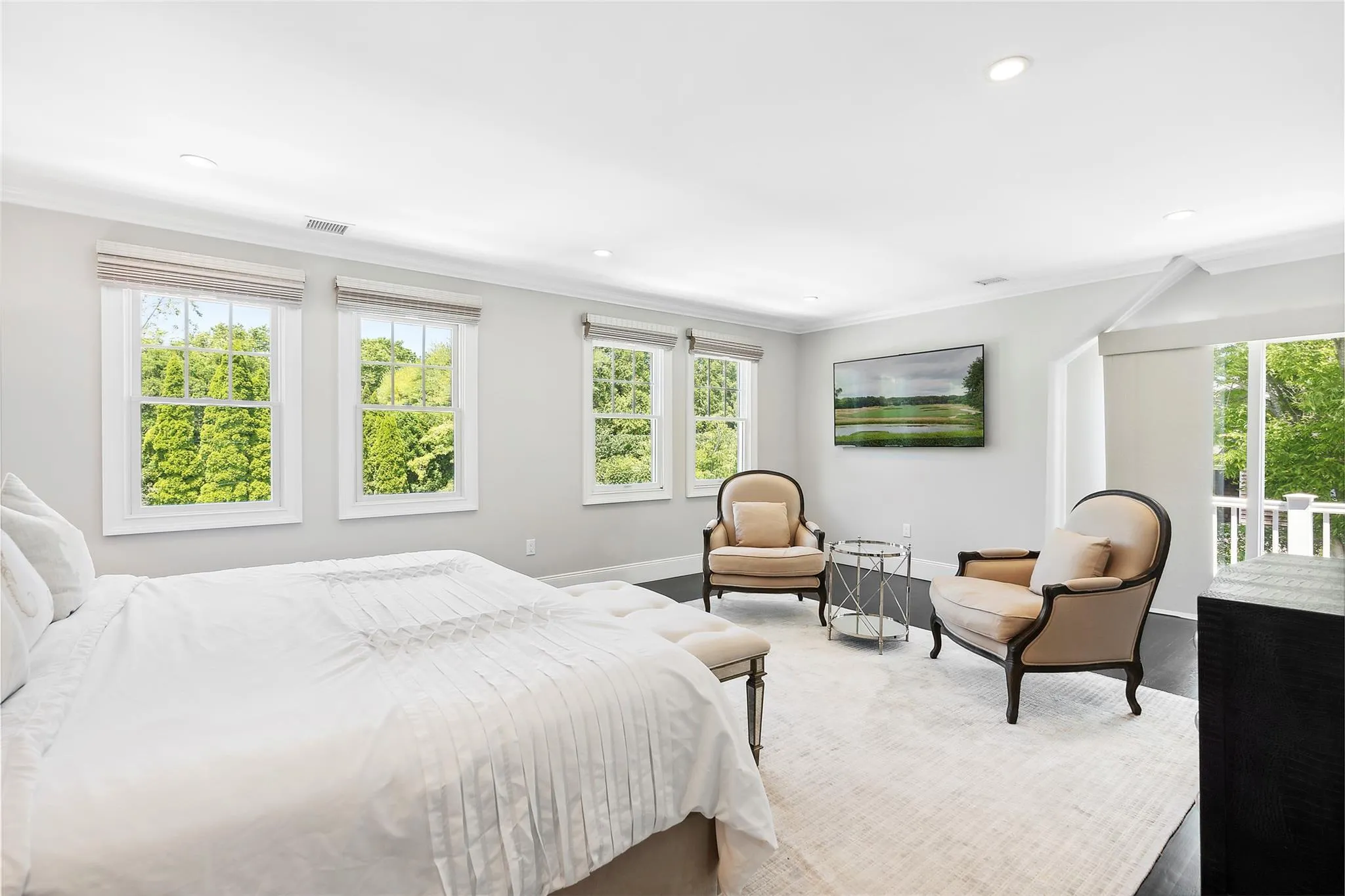Bedroom with recessed lighting, visible vents, multiple windows, and crown molding Bedroom with recessed lighting, visible vents, multiple windows, and crown molding