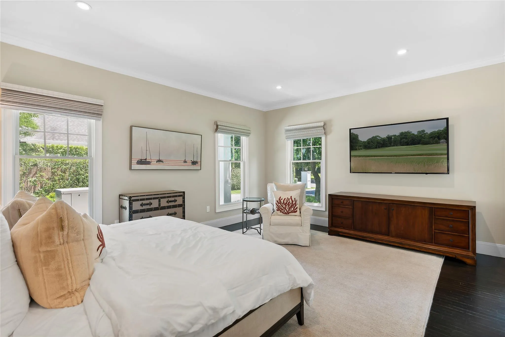 Bedroom with wood finished floors, baseboards, ornamental molding, and recessed lighting Bedroom with wood finished floors, baseboards, ornamental molding, and recessed lighting