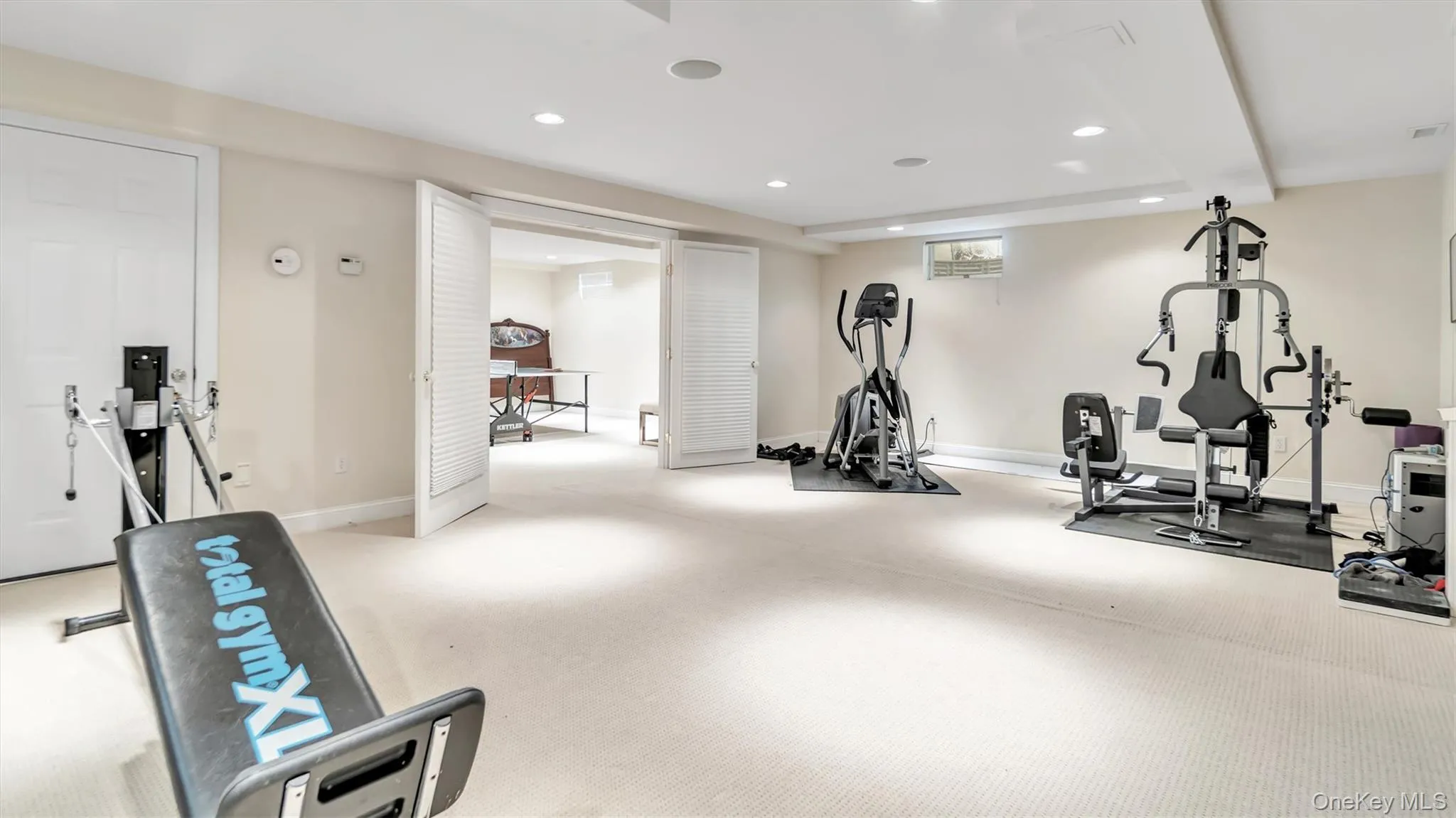 Exercise area with recessed lighting and baseboards Exercise area with recessed lighting and baseboards