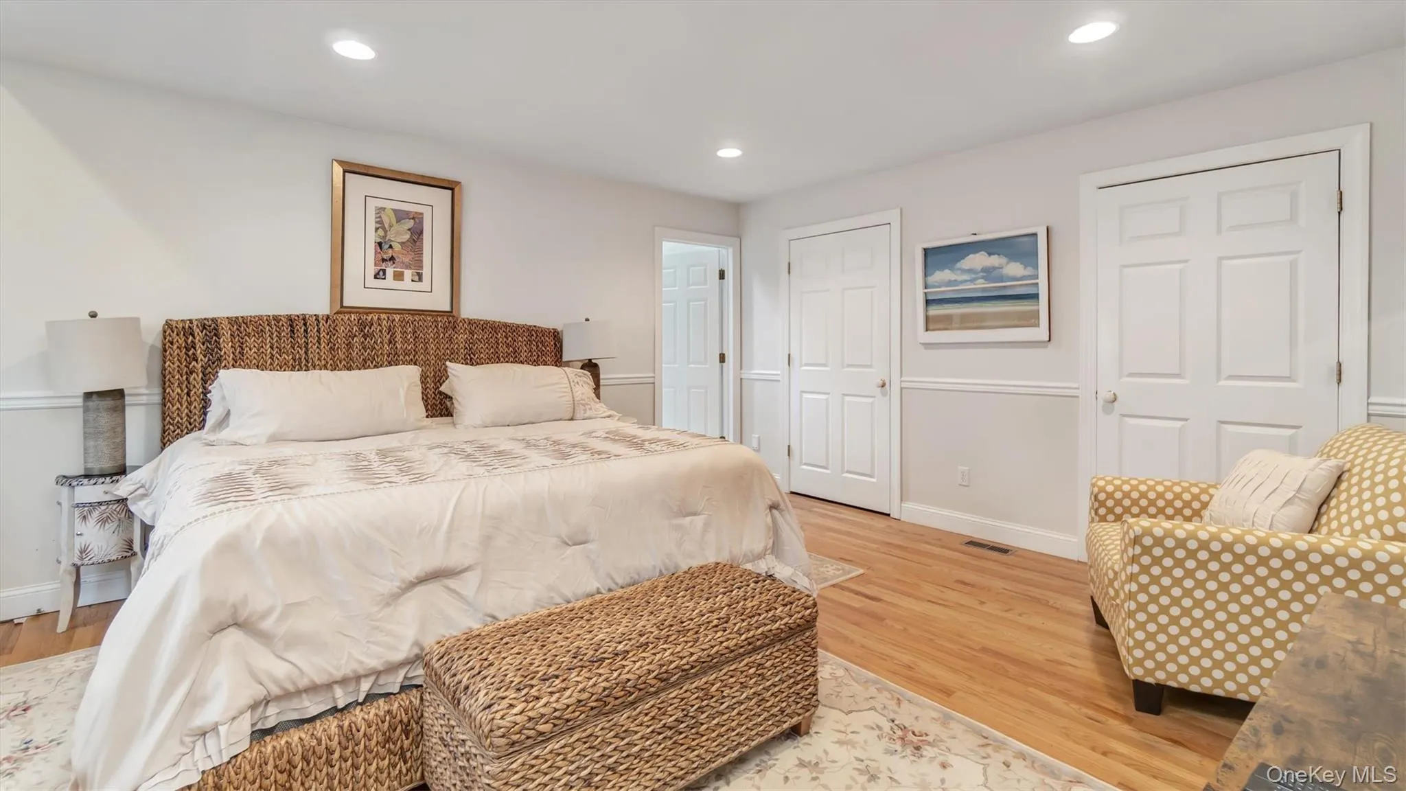 Bedroom with visible vents, light wood-style flooring, recessed lighting, and baseboards Bedroom with visible vents, light wood-style flooring, recessed lighting, and baseboards