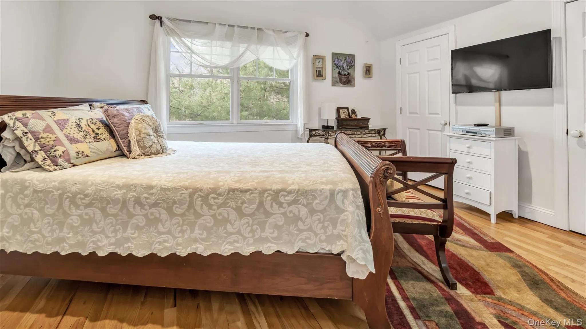 Bedroom with wood finished floors Bedroom with wood finished floors