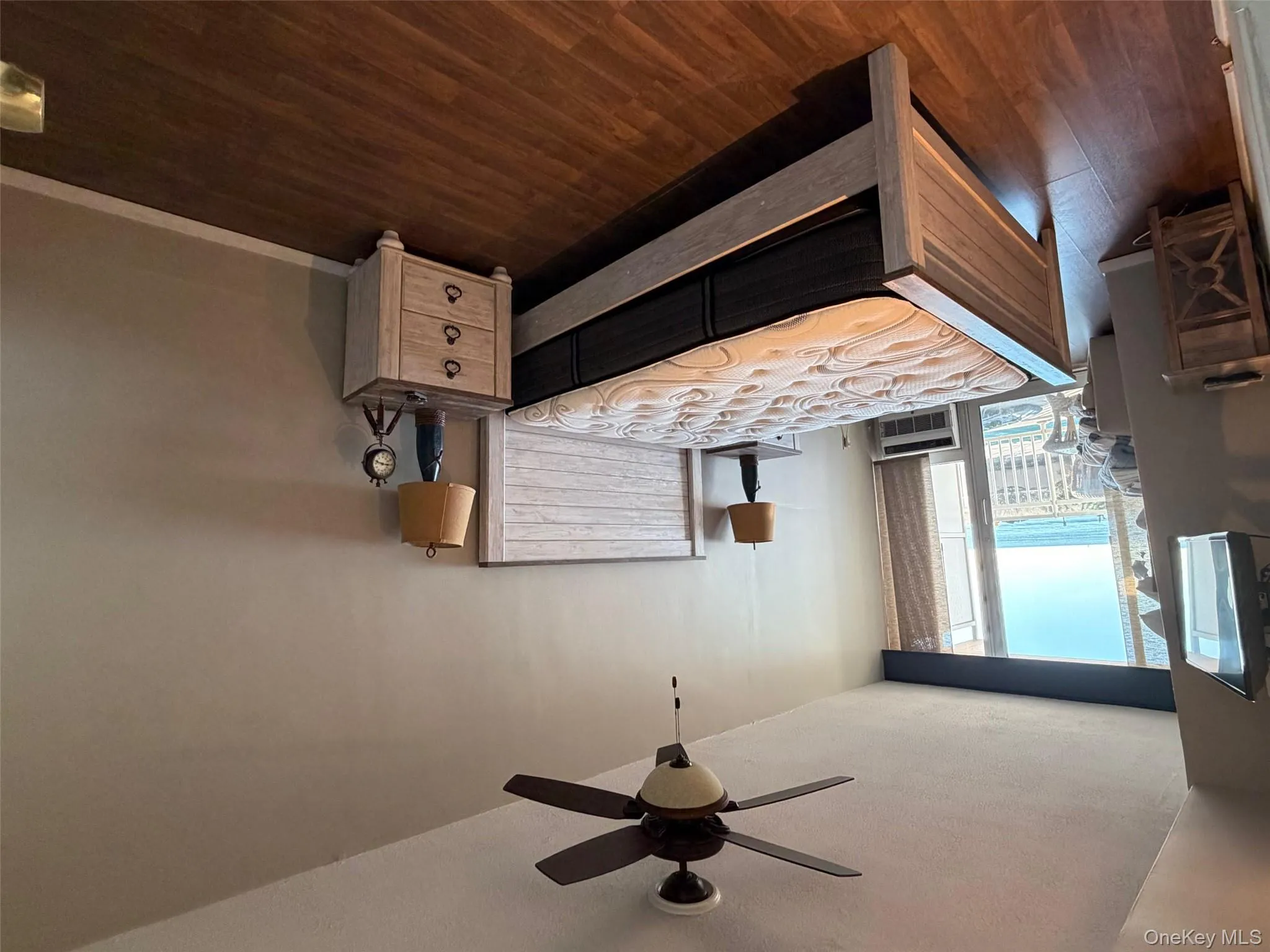 Bedroom with access to outside, dark wood-style flooring, and ceiling fan Bedroom with access to outside, dark wood-style flooring, and ceiling fan