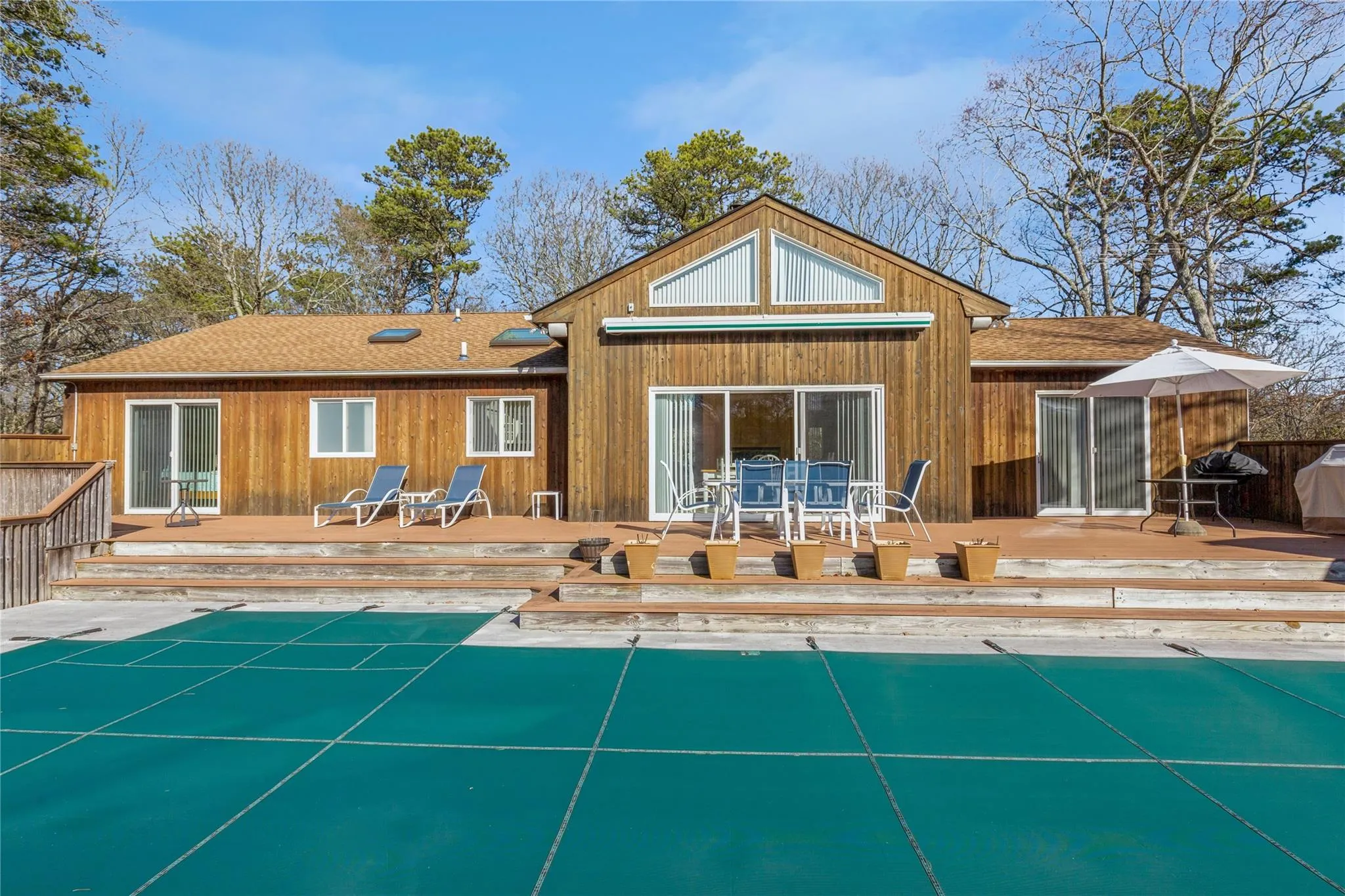 Rear view of house featuring a deck Rear view of house featuring a deck