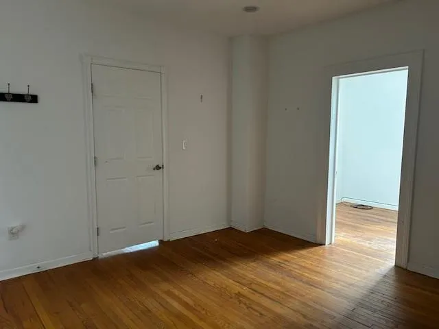 Unfurnished 2nd Office featuring wood floors and 2 doors Unfurnished 2nd Office featuring wood floors and 2 doors