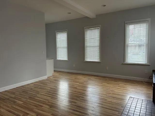 Unfurnished Open Space featuring recessed lighting, wood finished floors and multiple windows with natural light Unfurnished Open Space featuring recessed lighting, wood finished floors and multiple windows with natural light