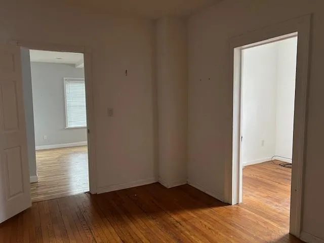 Unfurnished 2nd Office featuring wood floors and 2 doors Unfurnished 2nd Office featuring wood floors and 2 doors