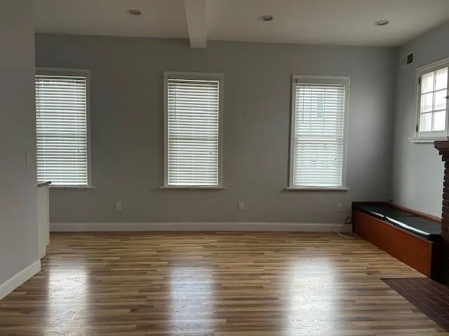 Unfurnished Open Space featuring recessed lighting, wood finished floors and multiple windows with natural light Unfurnished Open Space featuring recessed lighting, wood finished floors and multiple windows with natural light