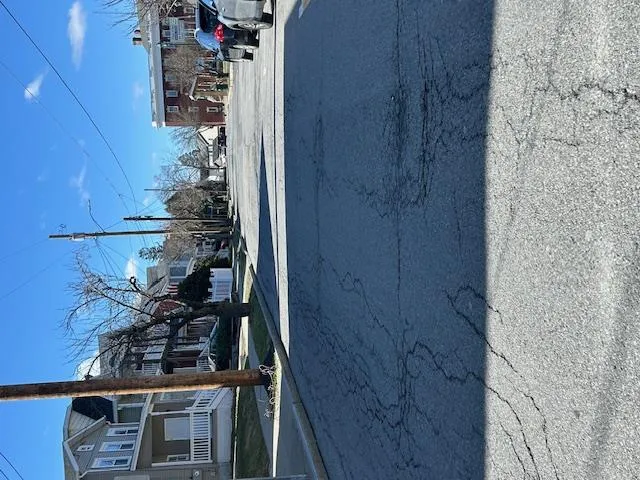 View of the road with street lighting, and sidewalks. View of the road with street lighting, and sidewalks.