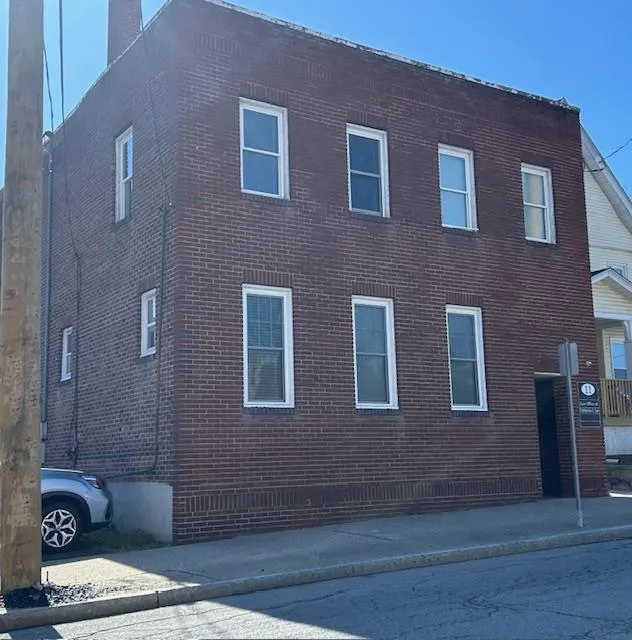 Front view of the brick building. Front view of the brick building.
