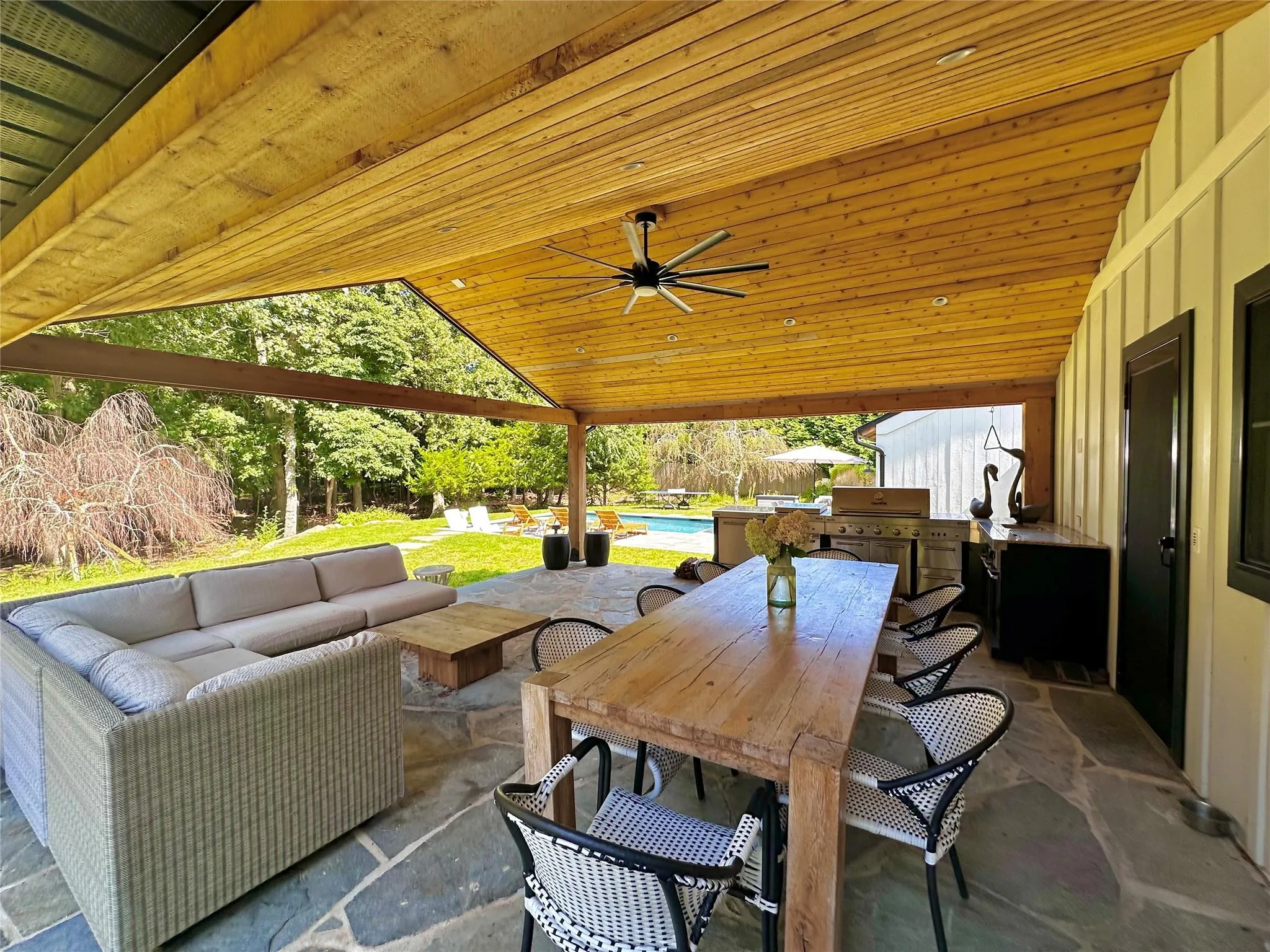 View of patio / terrace with an outdoor living space, ceiling fan, a grill, outdoor dining area, and an outdoor pool View of patio / terrace with an outdoor living space, ceiling fan, a grill, outdoor dining area, and an outdoor pool
