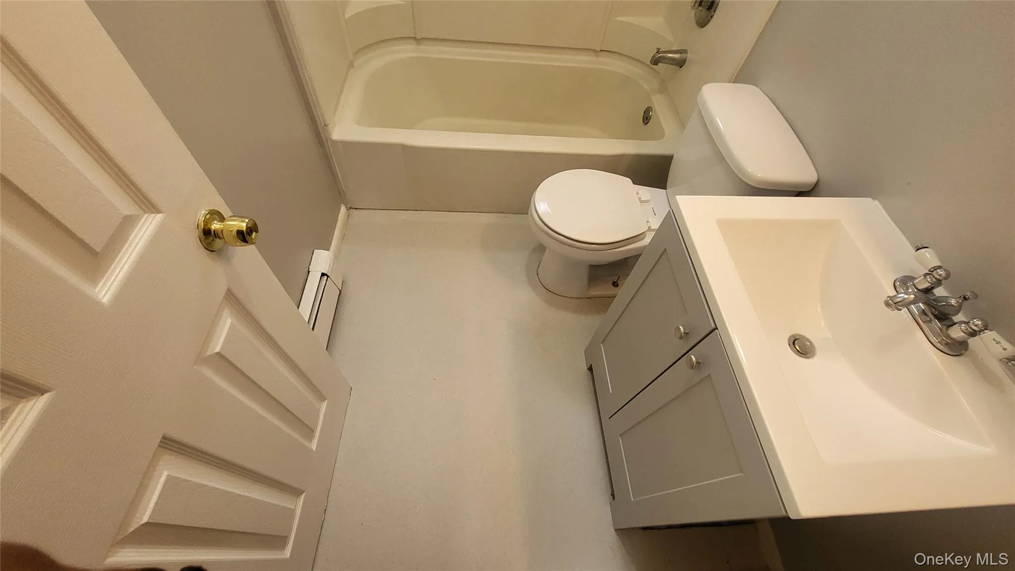 Full bathroom featuring vanity and toilet, tub w/shower Full bathroom featuring vanity and toilet, tub w/shower