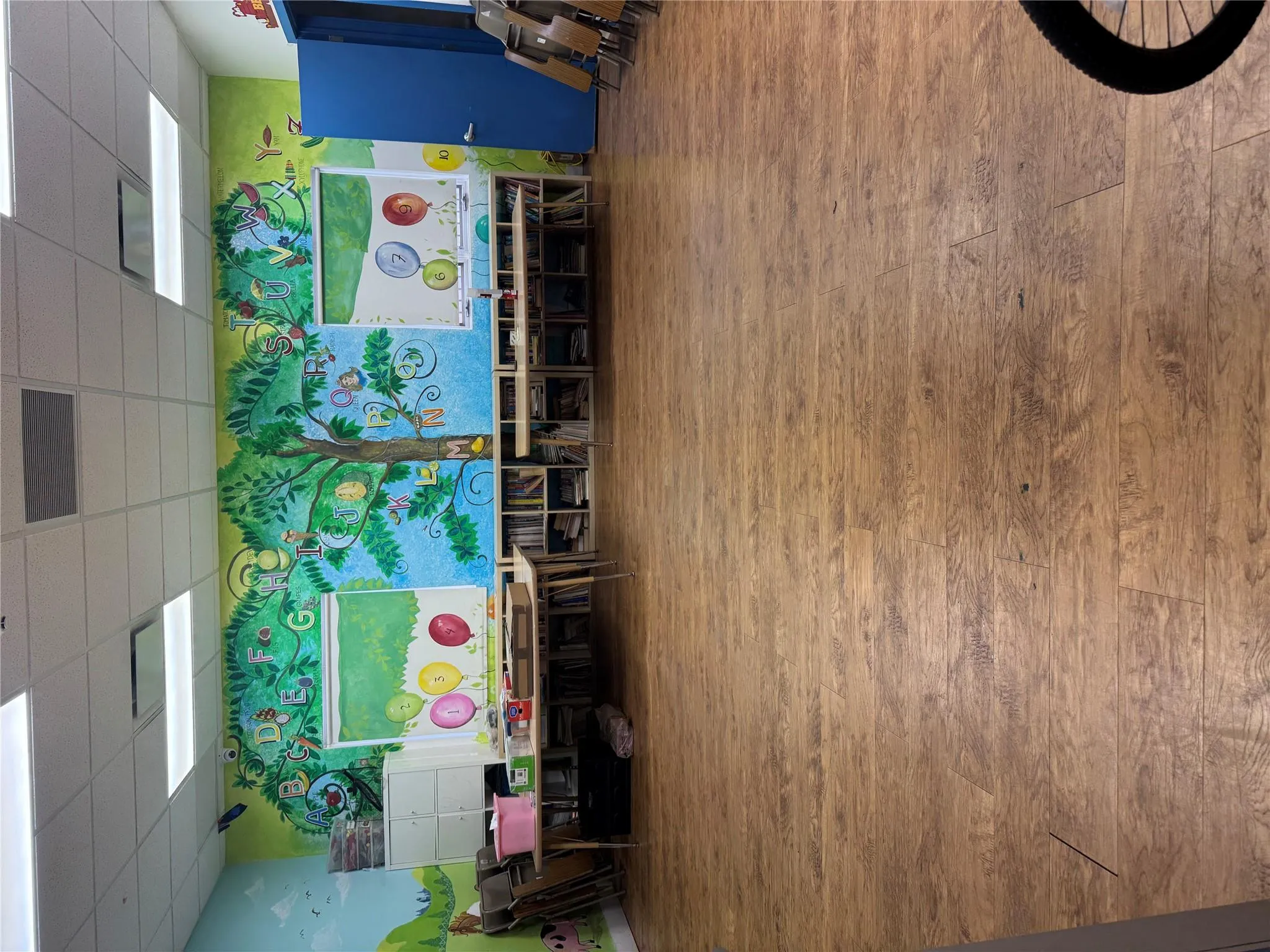 Rec room with visible vents, wood finished floors, and a paneled ceiling Rec room with visible vents, wood finished floors, and a paneled ceiling