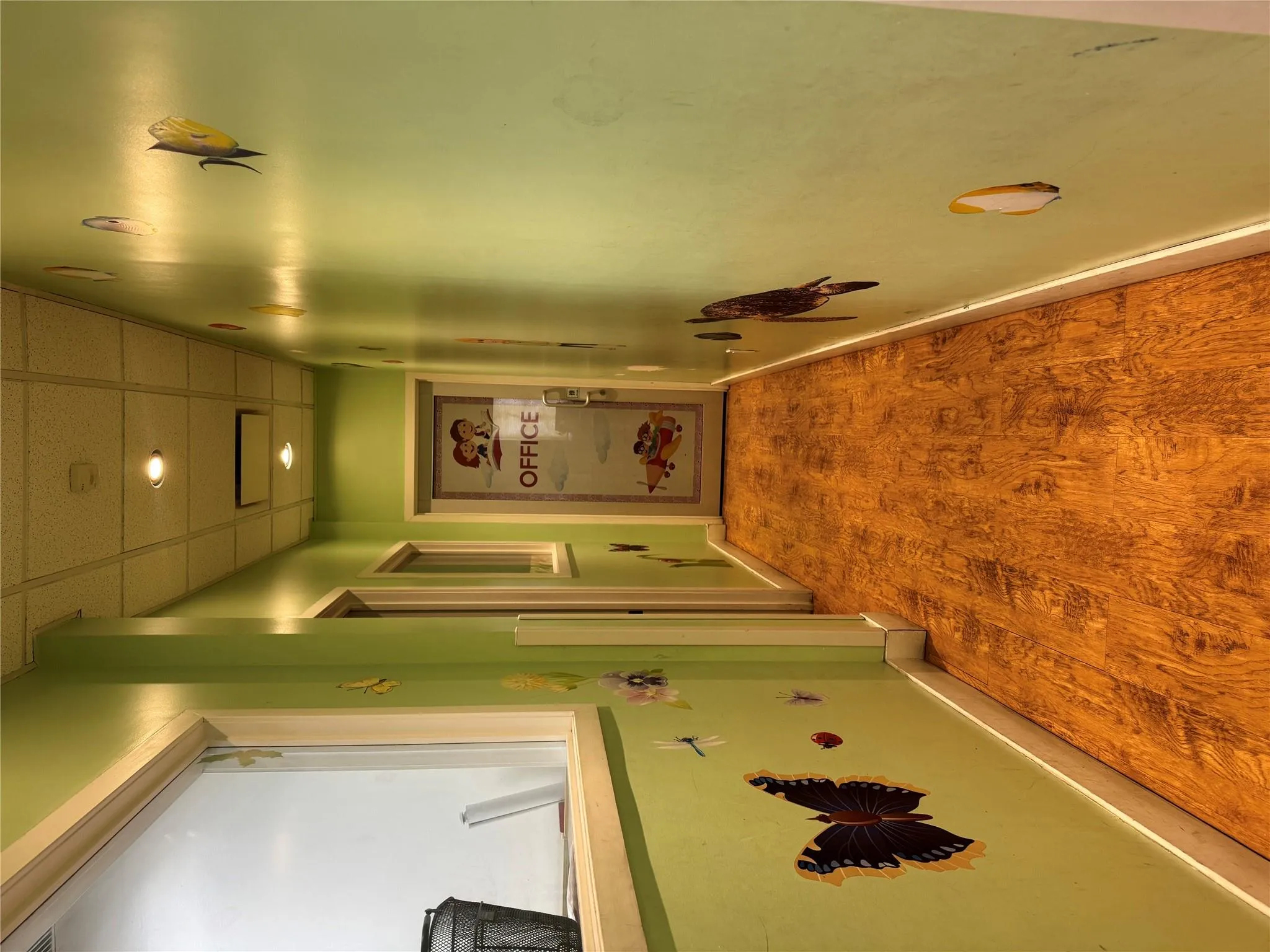 Corridor featuring visible vents, baseboards, wood finished floors, recessed lighting, and a paneled ceiling Corridor featuring visible vents, baseboards, wood finished floors, recessed lighting, and a paneled ceiling