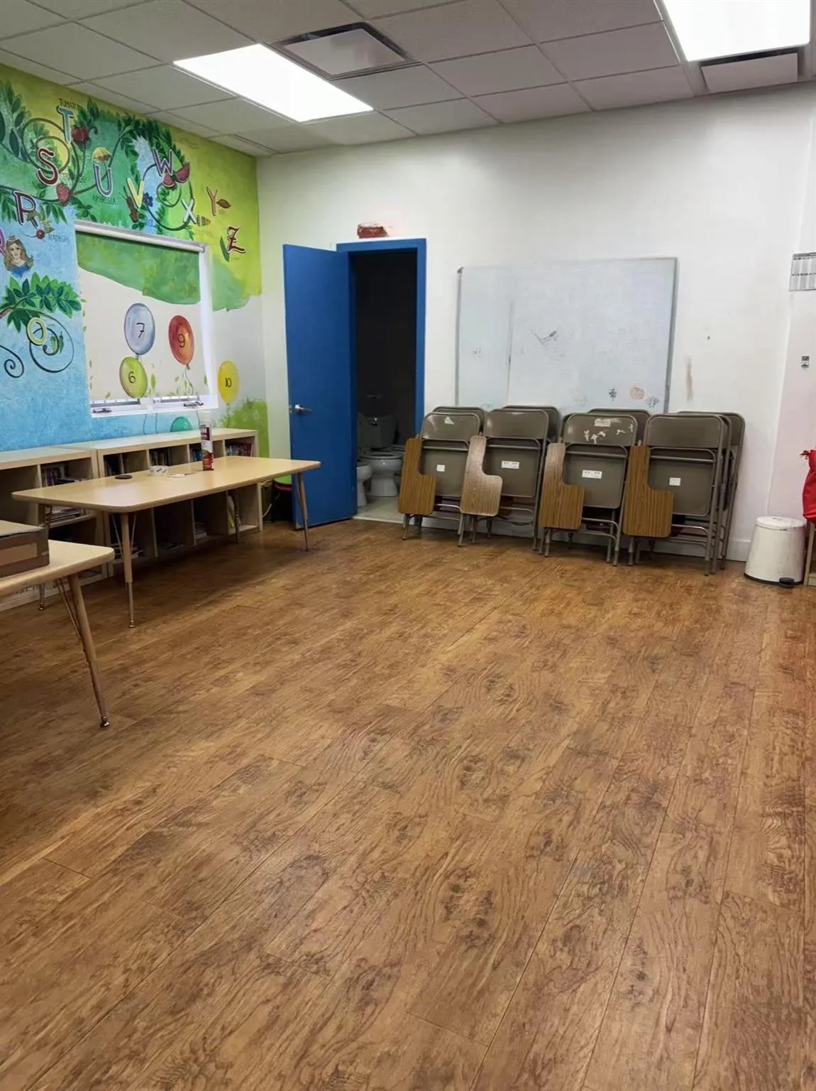 Game room with a drop ceiling and wood finished floors Game room with a drop ceiling and wood finished floors