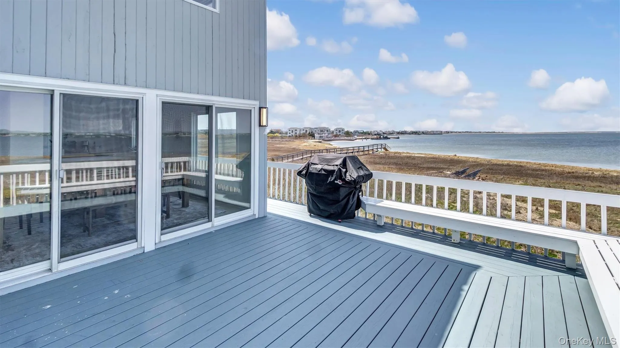Deck with a view of the beach and a water view Deck with a view of the beach and a water view