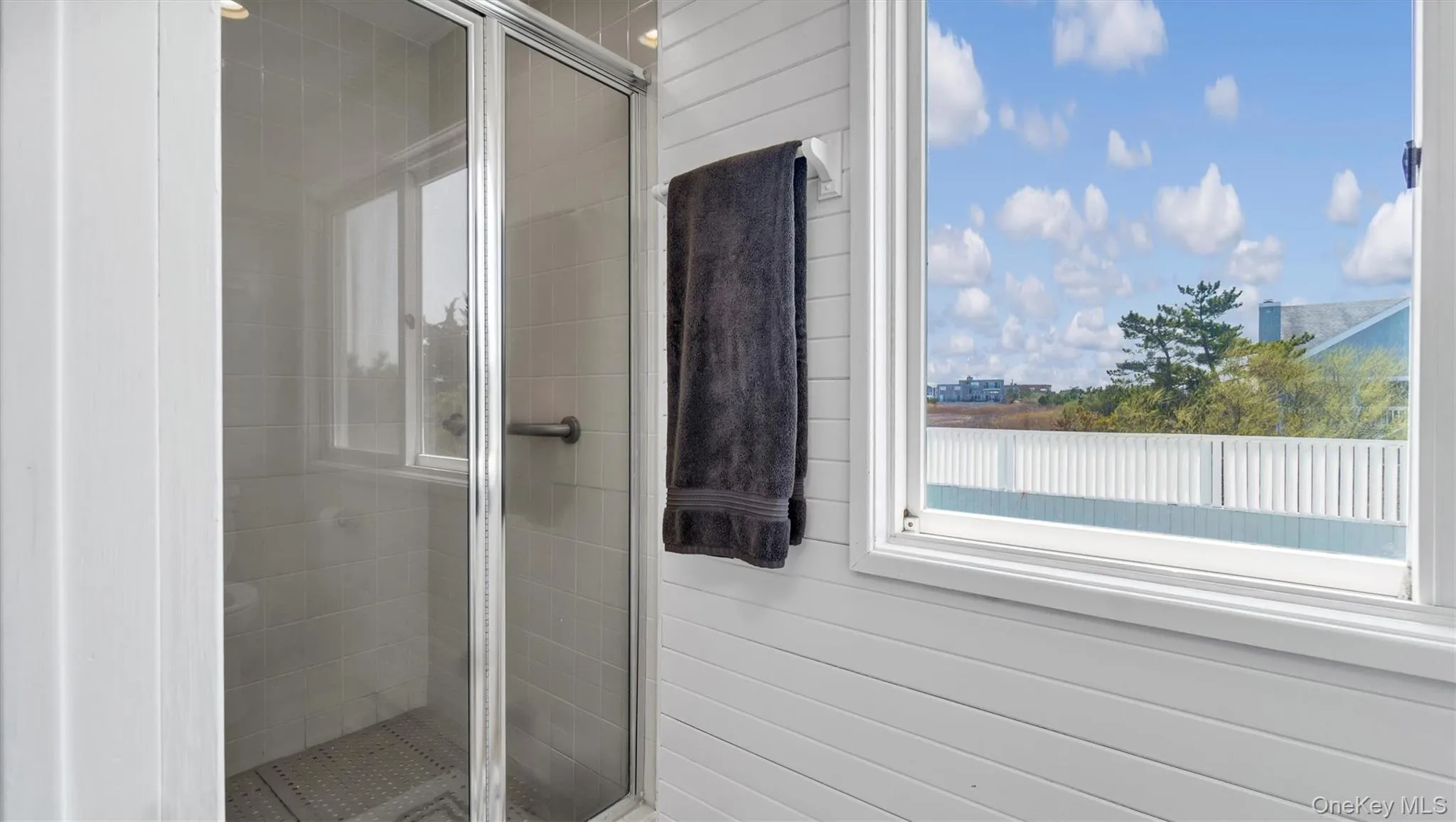 Bathroom with a shower stall Bathroom with a shower stall