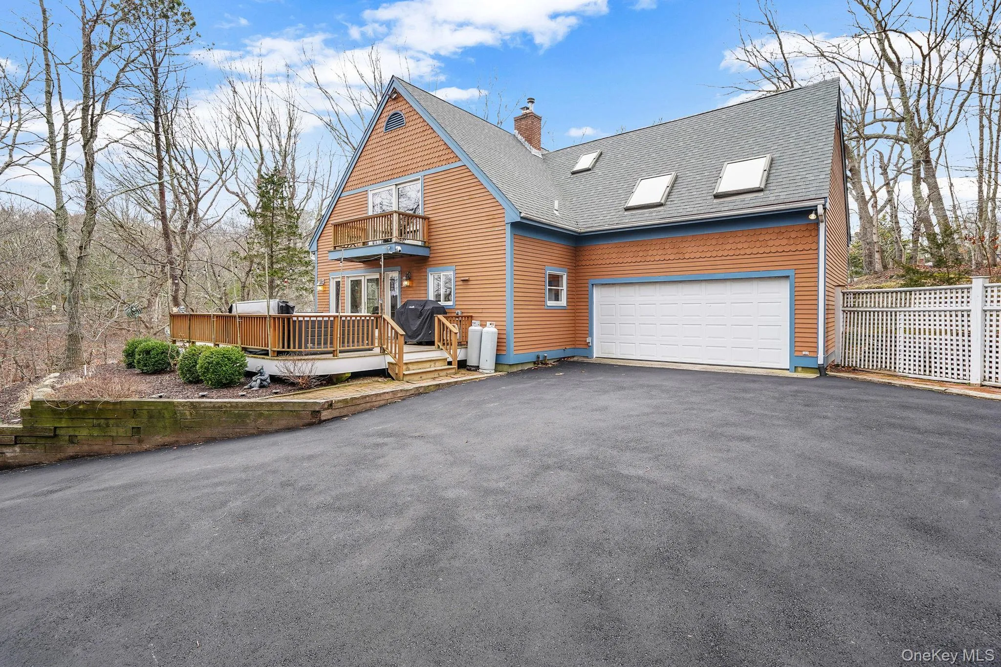 View of Home and Large Driveway with Ample Space for Parking. View of Deck with Hot Tub and Seating. Juliet Balcony Off Second Floor Bedroom View of Home and Large Driveway with Ample Space for Parking. View of Deck with Hot Tub and Seating. Juliet Balcony Off Second Floor Bedroom