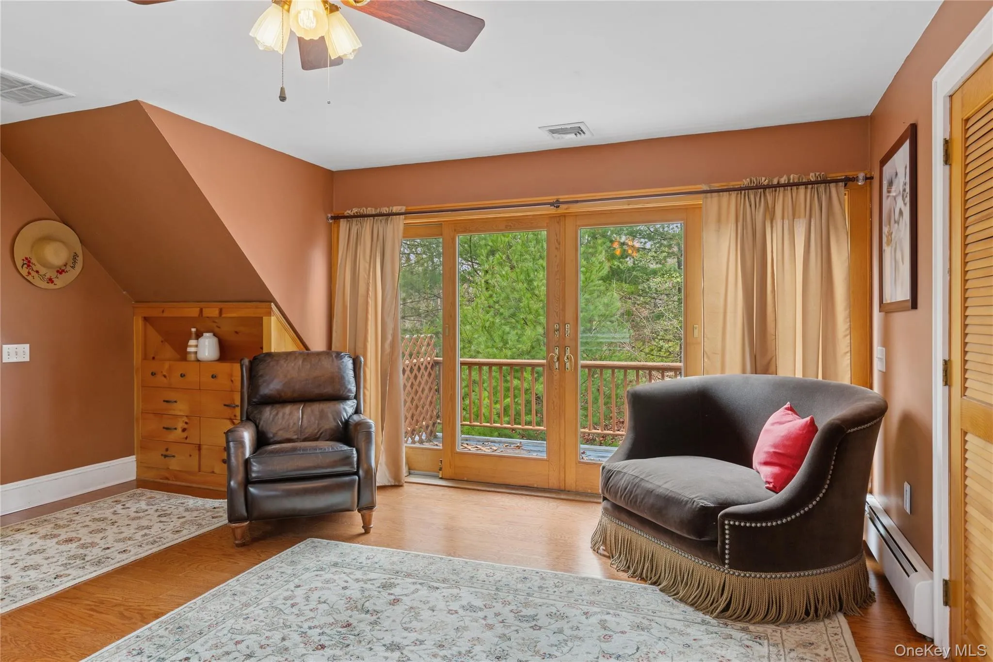 Tranquil Sitting Space in Primary Bedroom. Balcony with Sliding Door Access Tranquil Sitting Space in Primary Bedroom. Balcony with Sliding Door Access