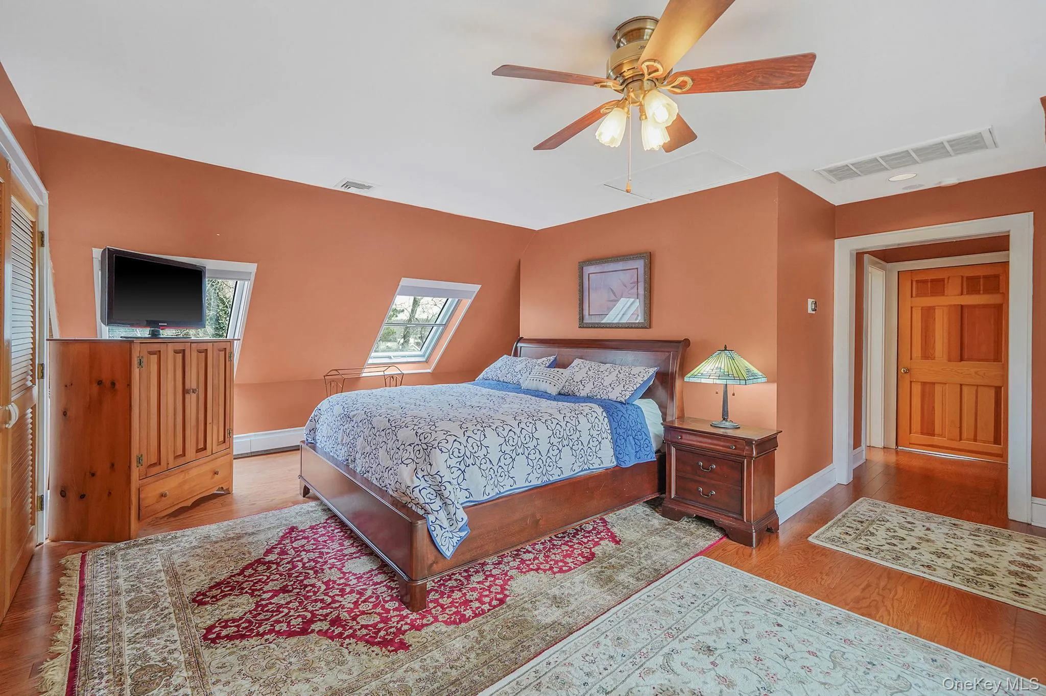 Sky-Lit Primary Bedroom with Custom Built-In Drawers. Large Cedar Closet. Private Balcony with Sliding Door Access Sky-Lit Primary Bedroom with Custom Built-In Drawers. Large Cedar Closet. Private Balcony with Sliding Door Access