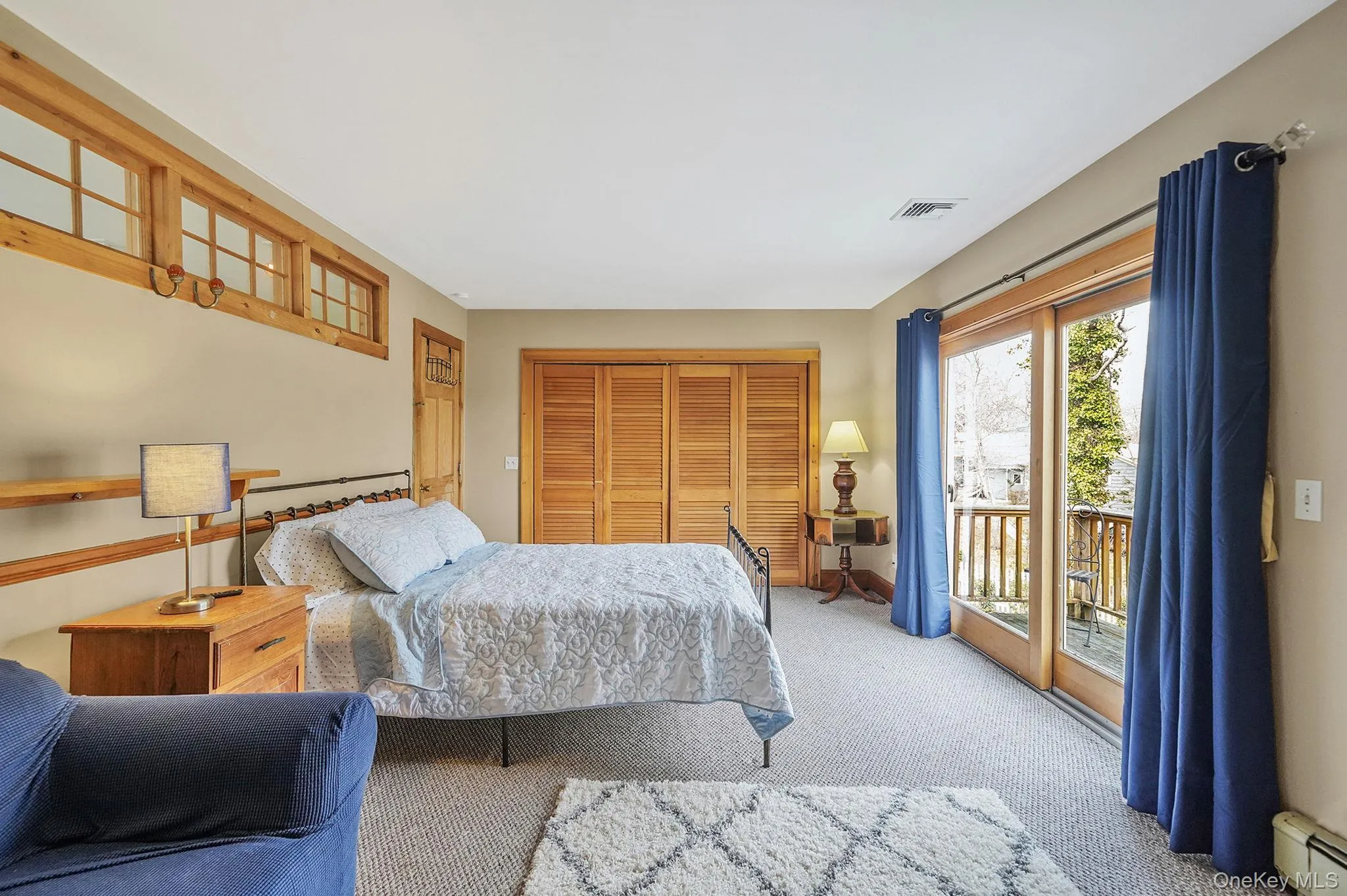 Large Second Floor Bedroom with Private Juliet Balcony Overlooking Outdoor Decking Area. Great Inlet Views from Here Off Season Large Second Floor Bedroom with Private Juliet Balcony Overlooking Outdoor Decking Area. Great Inlet Views from Here Off Season