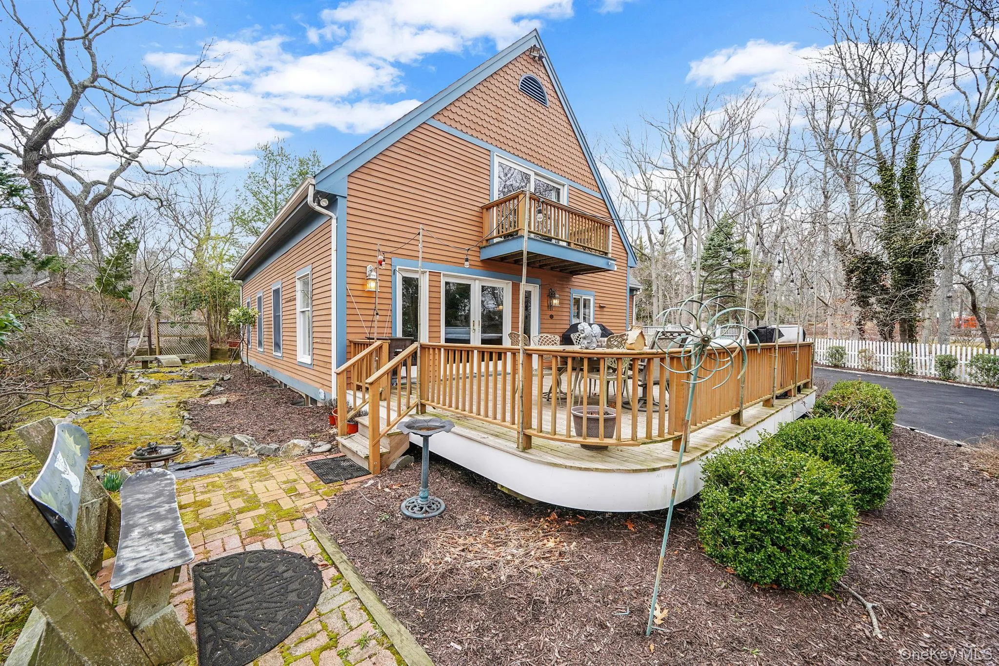 View of Home and Large Driveway with Ample Space for Parking. View of Deck with Hot Tub and Seating. Juliet Balcony Off Second Floor Bedroom. Sliding Doors Used as Front Entry View of Home and Large Driveway with Ample Space for Parking. View of Deck with Hot Tub and Seating. Juliet Balcony Off Second Floor Bedroom. Sliding Doors Used as Front Entry