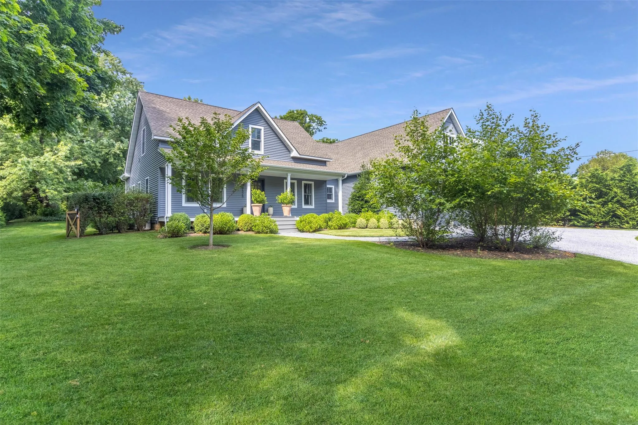 View of front of house featuring a porch, roof with shingles, and a front lawn View of front of house featuring a porch, roof with shingles, and a front lawn