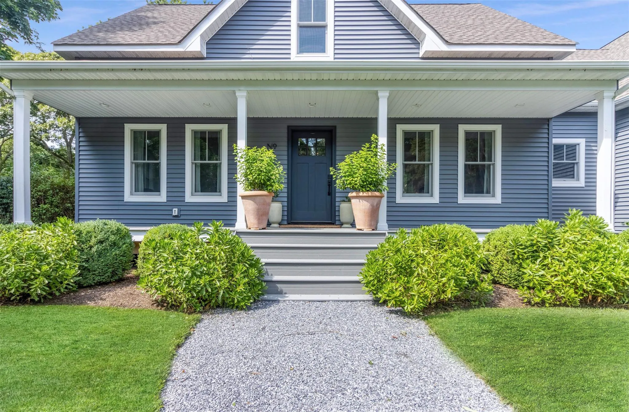 Entrance to property with covered porch and roof with shingles Entrance to property with covered porch and roof with shingles