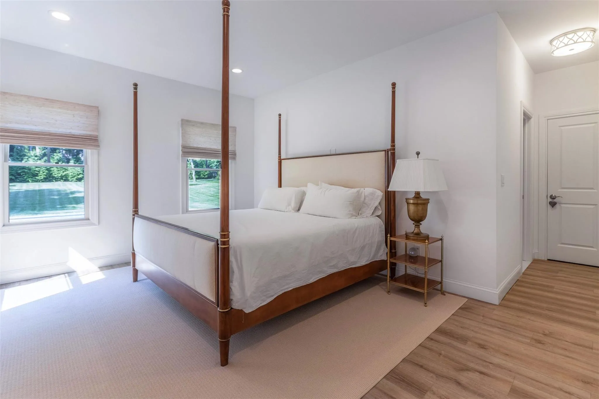 Bedroom featuring light wood finished floors, baseboards, and recessed lighting Bedroom featuring light wood finished floors, baseboards, and recessed lighting