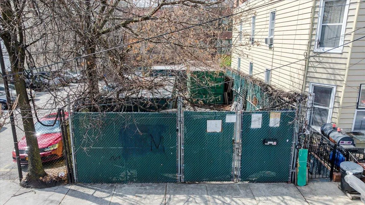 View of home's exterior with a gate and fence View of home's exterior with a gate and fence