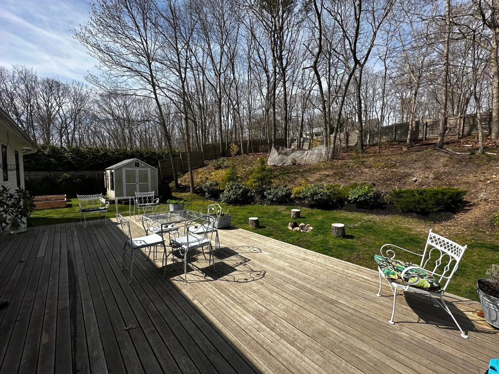Deck featuring an outdoor structure, outdoor dining area, a yard, and a storage shed Deck featuring an outdoor structure, outdoor dining area, a yard, and a storage shed