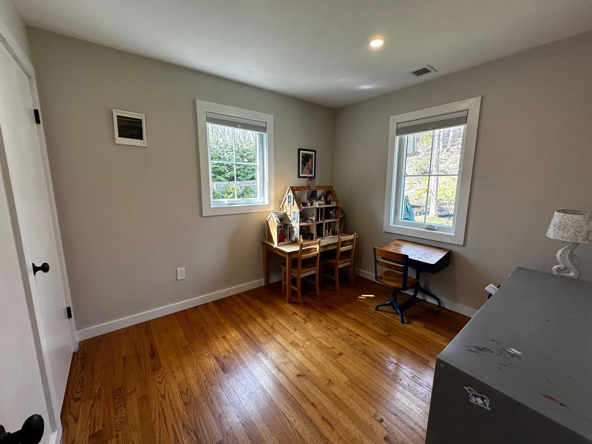 Office featuring light wood-style flooring, baseboards, and a healthy amount of sunlight Office featuring light wood-style flooring, baseboards, and a healthy amount of sunlight