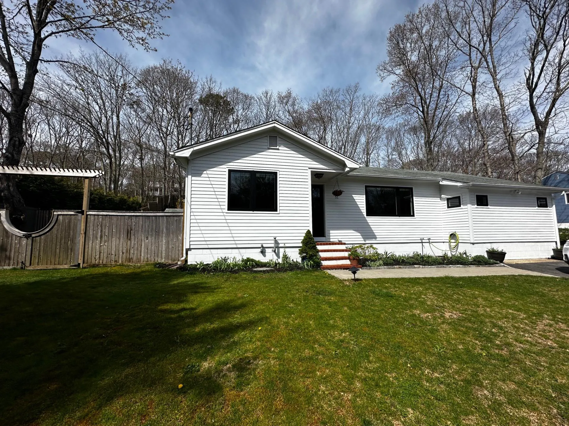 View of front of property with fence and a front yard View of front of property with fence and a front yard
