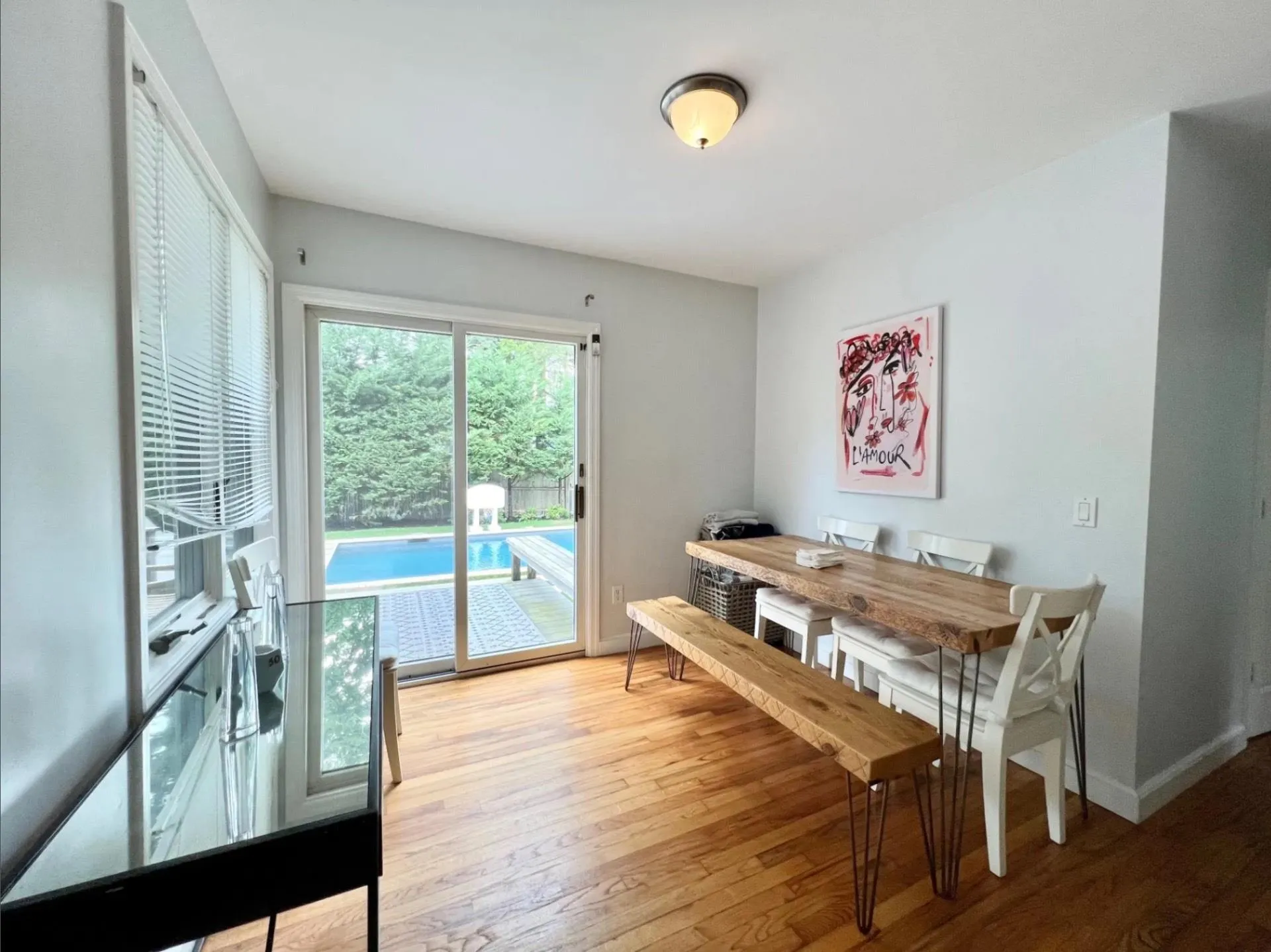 Dining space featuring baseboards and light wood-style floors Dining space featuring baseboards and light wood-style floors