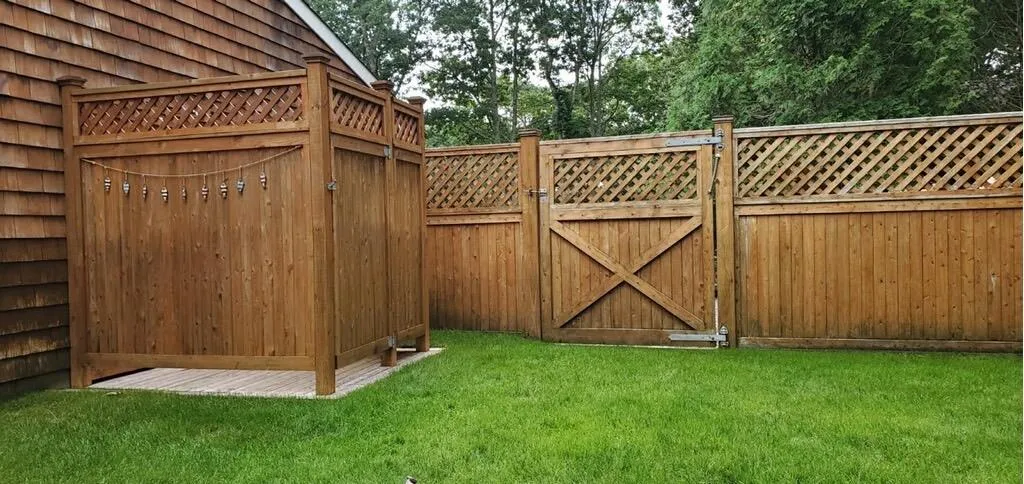 View of gate featuring fence and a yard View of gate featuring fence and a yard