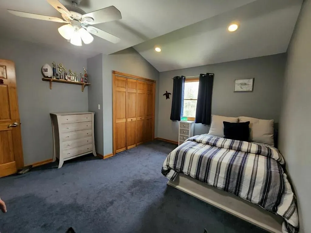 Carpeted bedroom featuring a closet, baseboards, ceiling fan, recessed lighting, and lofted ceiling Carpeted bedroom featuring a closet, baseboards, ceiling fan, recessed lighting, and lofted ceiling