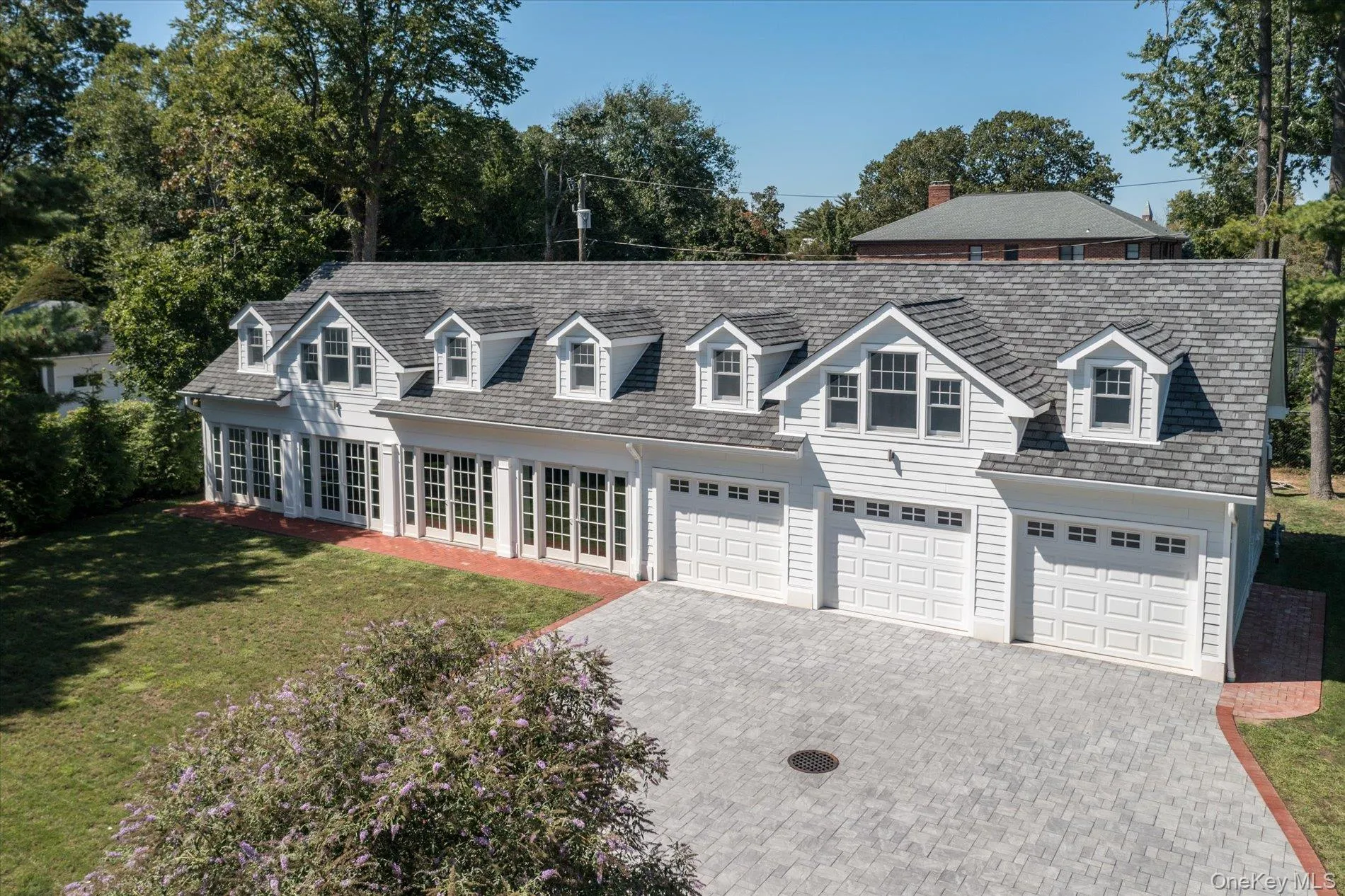 1305 sq ft terrace room featuring a gas fireplace and 4 sets of French doors overlooking the beautifully landscaped property 1305 sq ft terrace room featuring a gas fireplace and 4 sets of French doors overlooking the beautifully landscaped property
