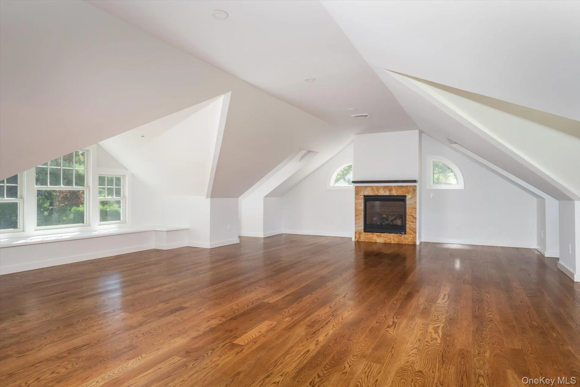 Upper level recreation room with gas fireplace and half bath Upper level recreation room with gas fireplace and half bath