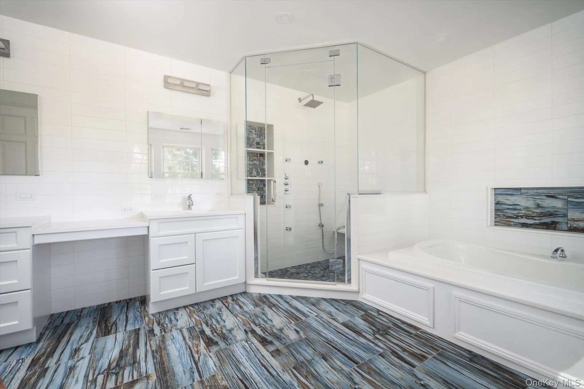 Primary bathroom with 6 jets and rainshower plus Hydro Massage tub and double vanities Primary bathroom with 6 jets and rainshower plus Hydro Massage tub and double vanities