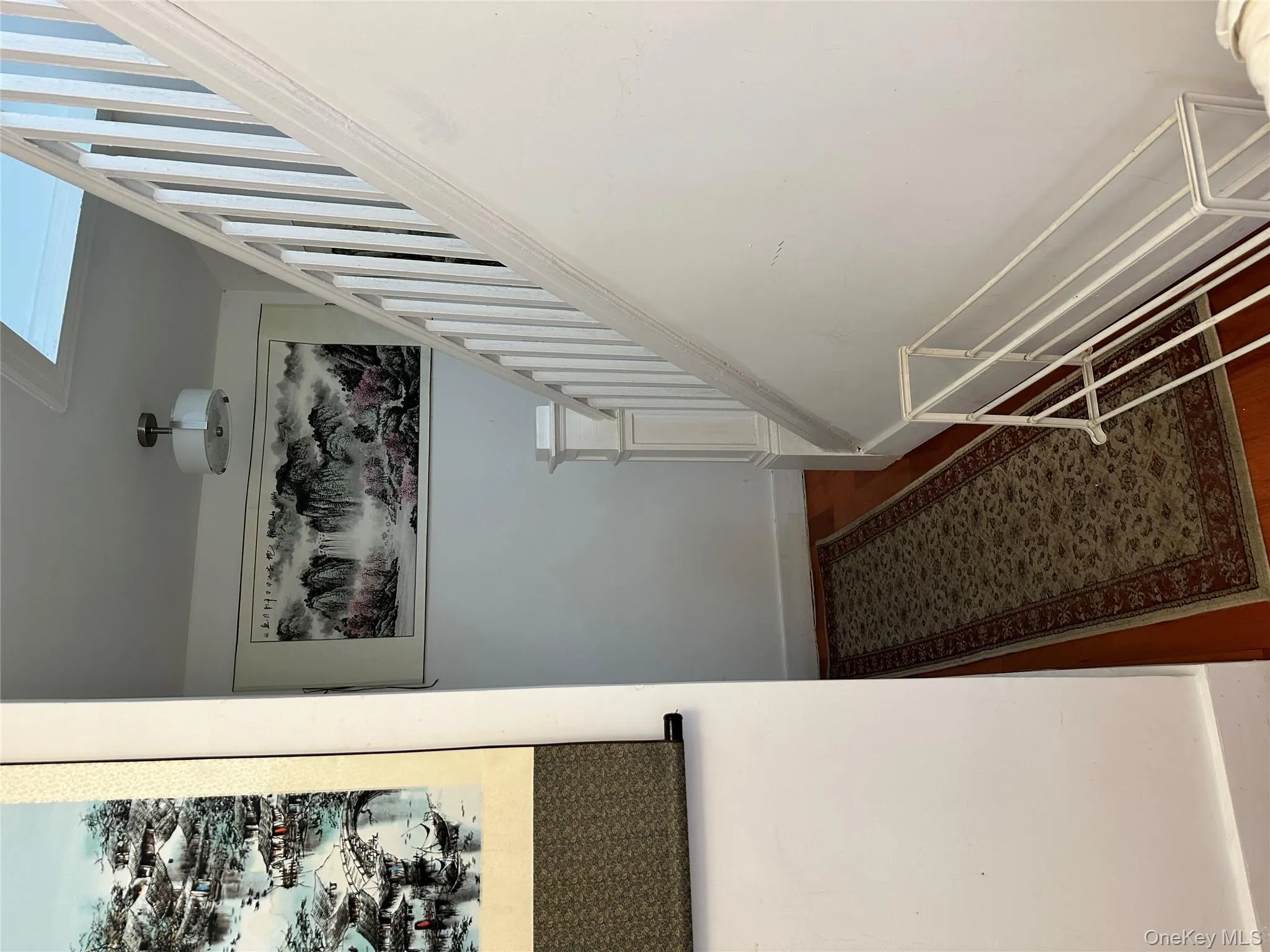 Staircase featuring baseboards Staircase featuring baseboards