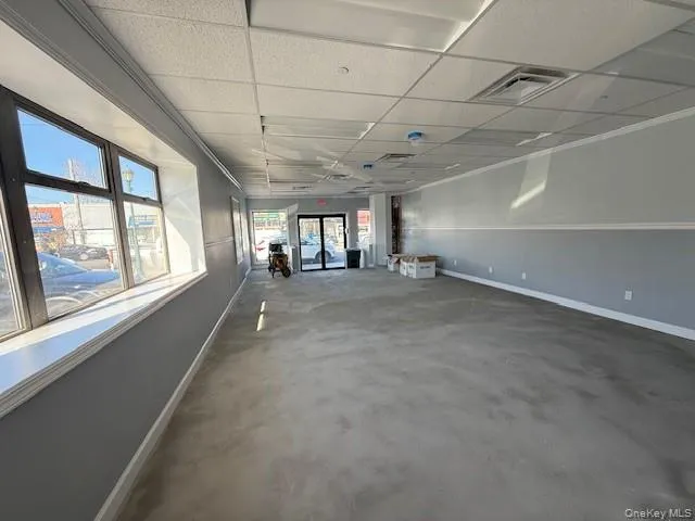 Office Area featuring baseboards and visible vents Office Area featuring baseboards and visible vents