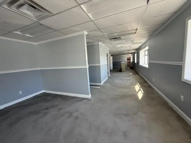Office Area featuring baseboards and visible vents Office Area featuring baseboards and visible vents