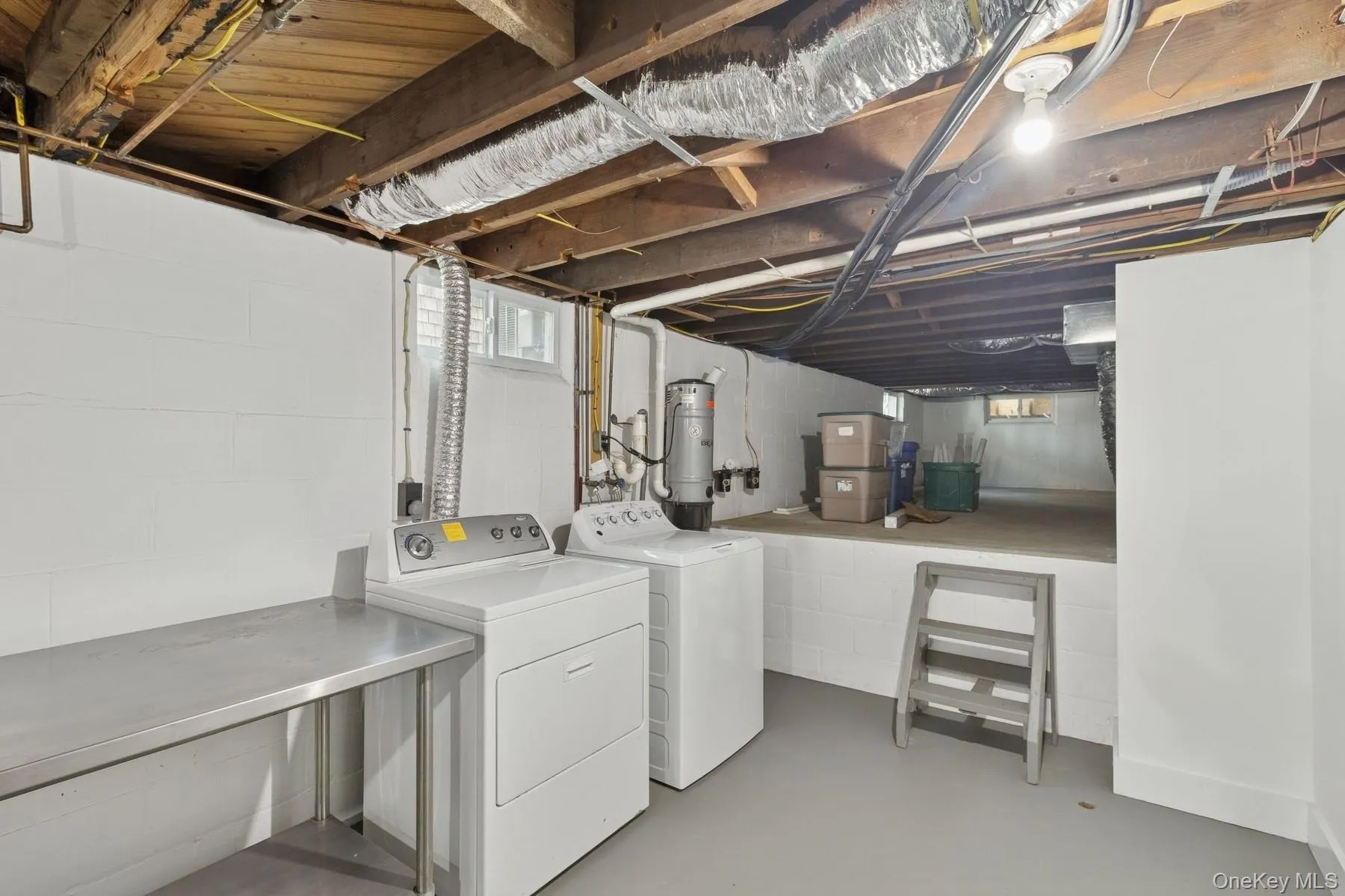 Laundry area featuring washer and clothes dryer and laundry area Laundry area featuring washer and clothes dryer and laundry area