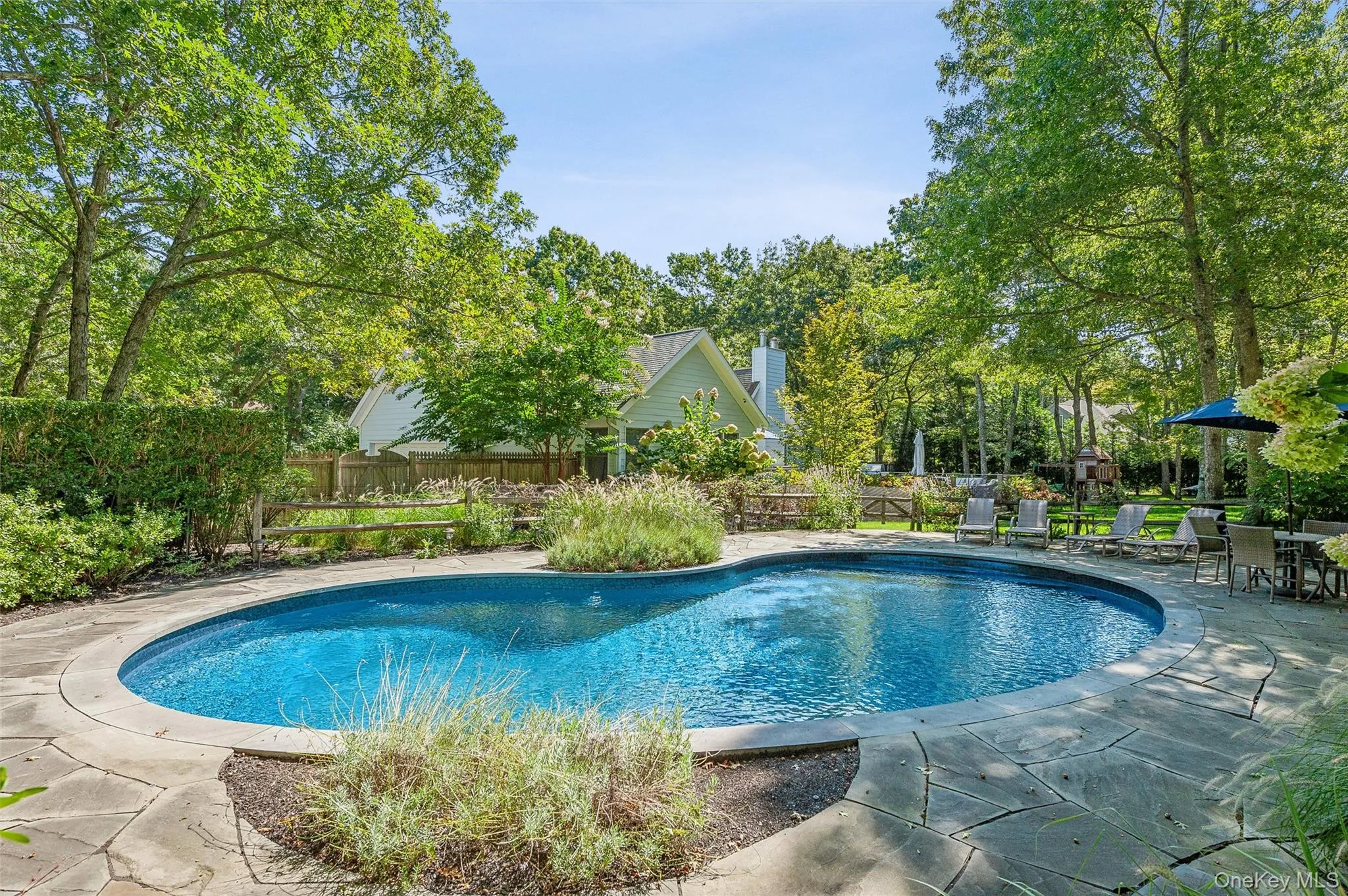 View of swimming pool featuring fence, a patio, and a fenced in pool View of swimming pool featuring fence, a patio, and a fenced in pool