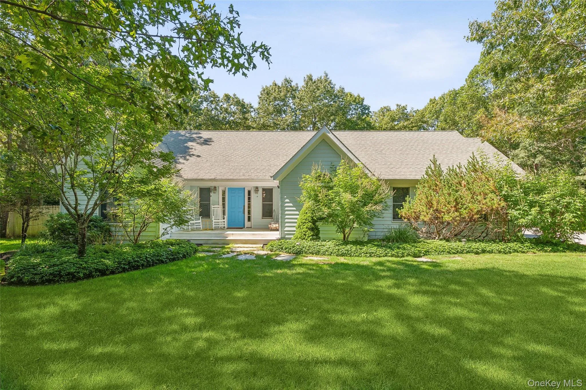 Ranch-style home featuring a front yard and roof with shingles Ranch-style home featuring a front yard and roof with shingles